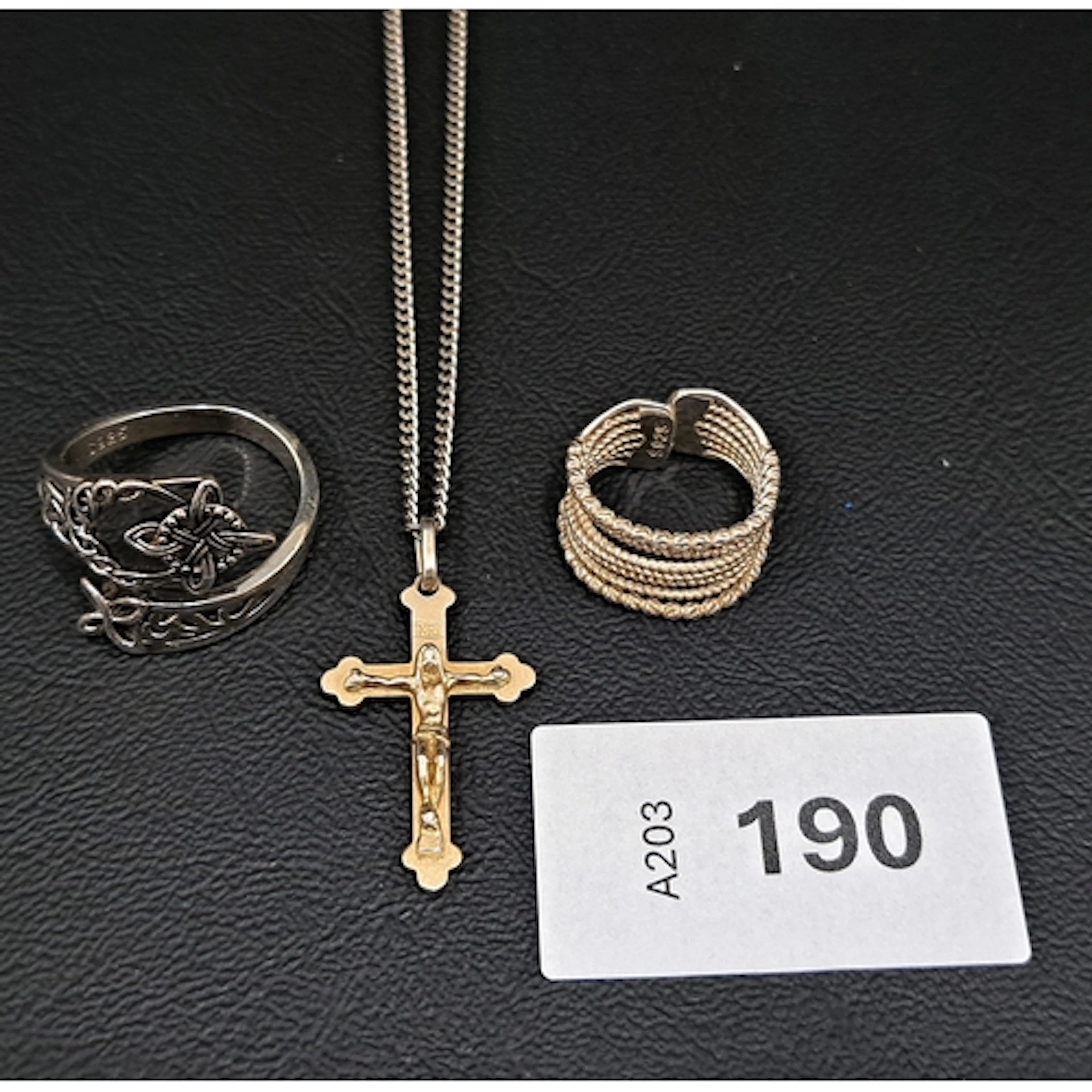 THREE PIECES OF SILVER JEWELLERY comprising a cross pendant ...