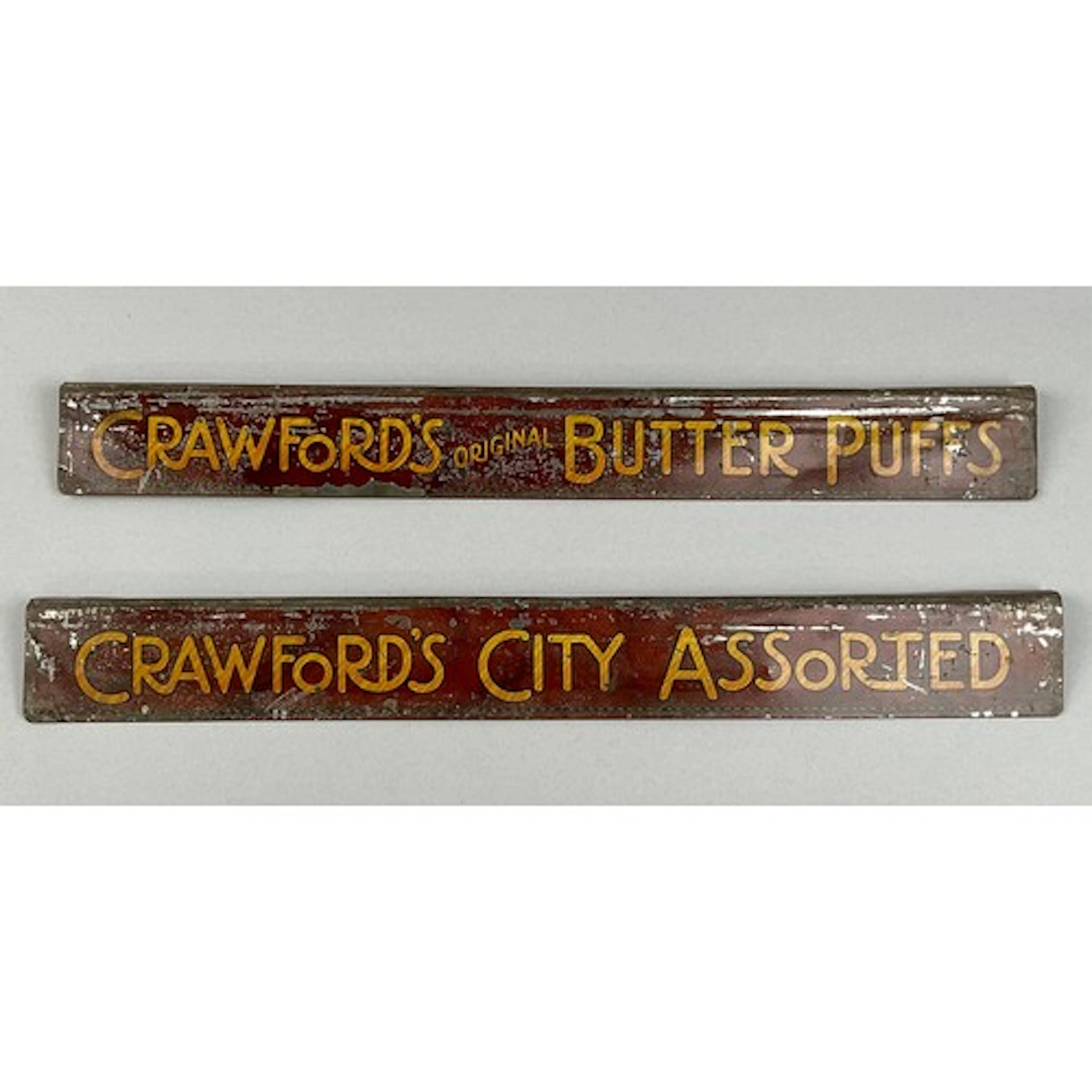 Advertising - a pair of early 20th century tin shelf edge si...