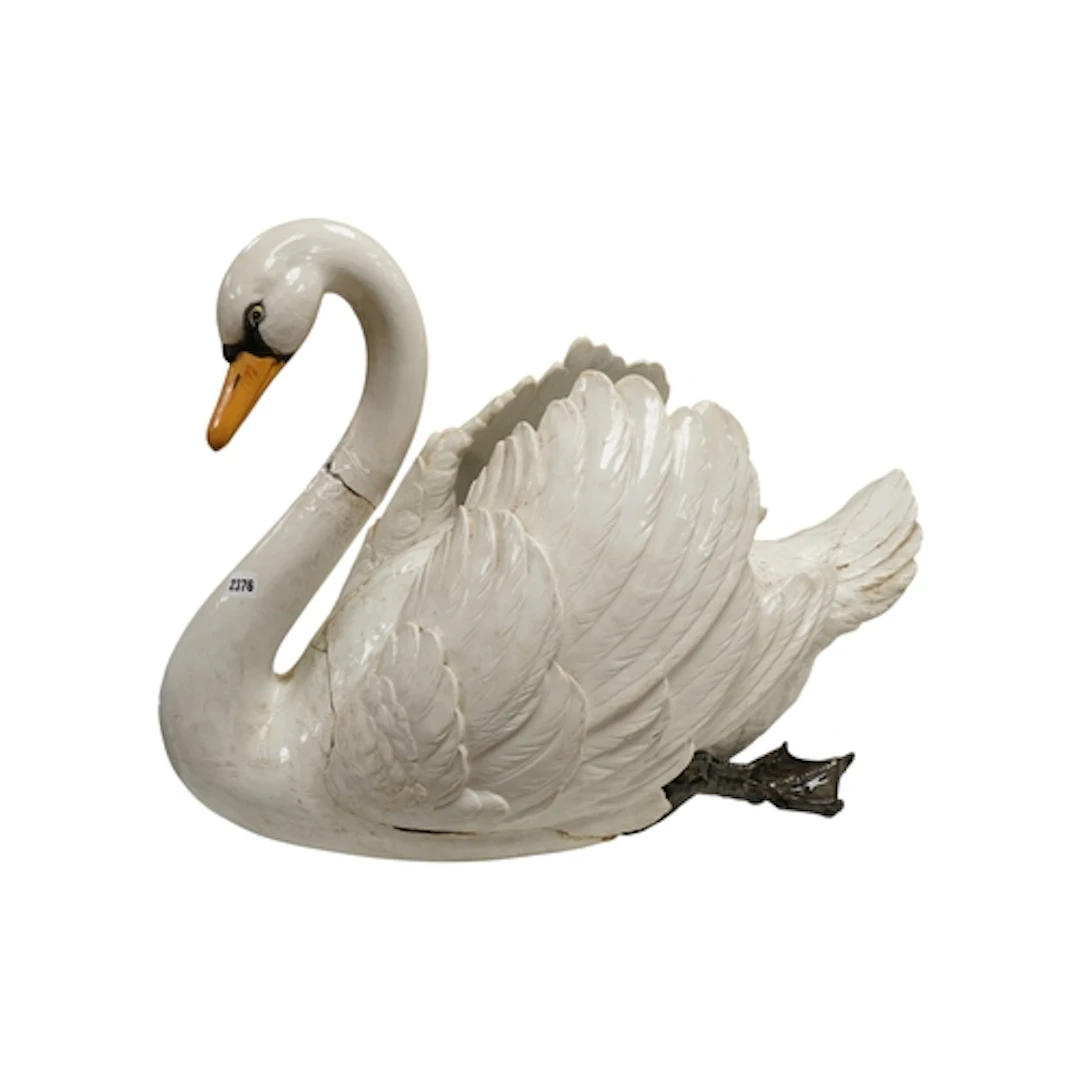 A large glazed earthenware planter modelled as a swan, heigh...