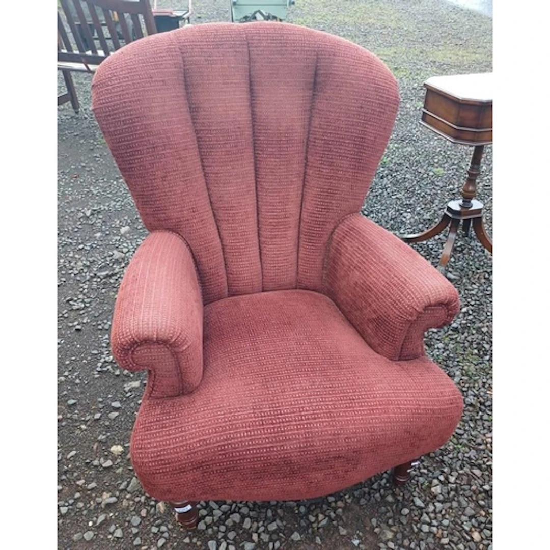 OVERSTUFFED ARMCHAIR ON TURNED SUPPORTS