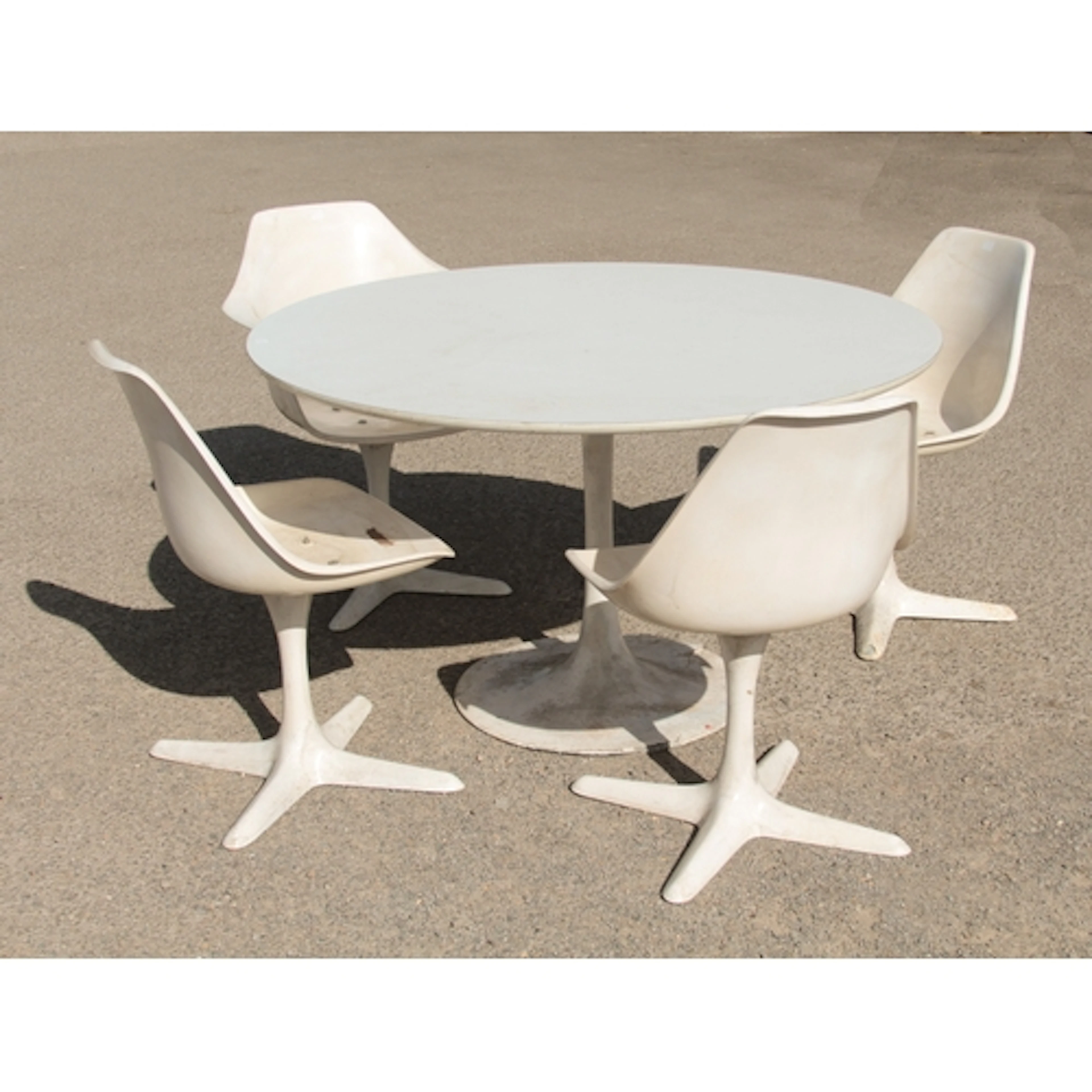 Maurice Burke for Arkana: a 'Tulip' dining table and four 'S...