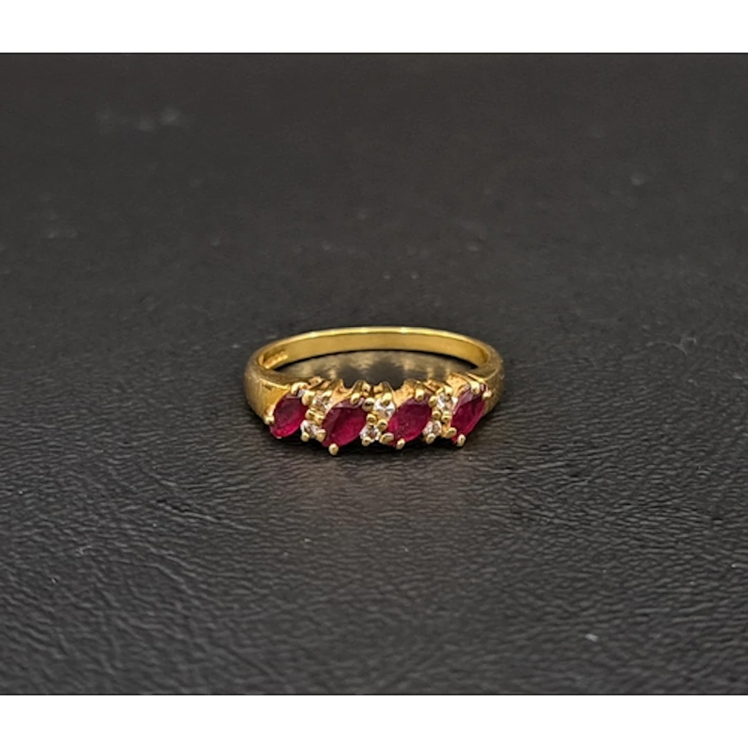 RUBY AND DIAMOND RING the four marquise cut rubies totalling...
