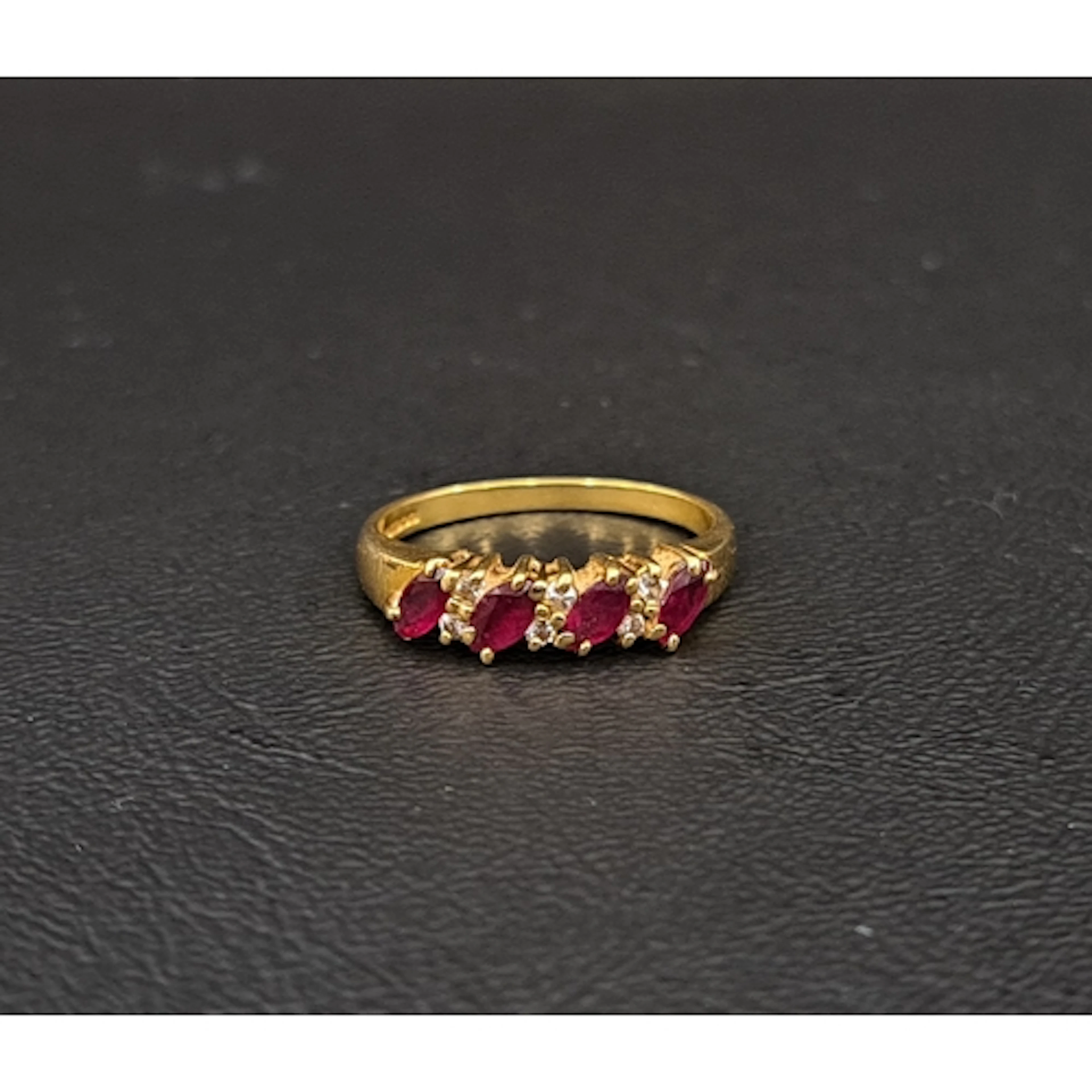 RUBY AND DIAMOND RING the four marquise cut rubies totalling...