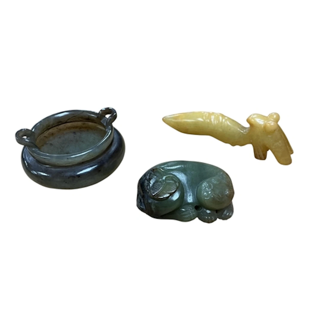 A Chinese green and black jade figure of a cat and butterfly...