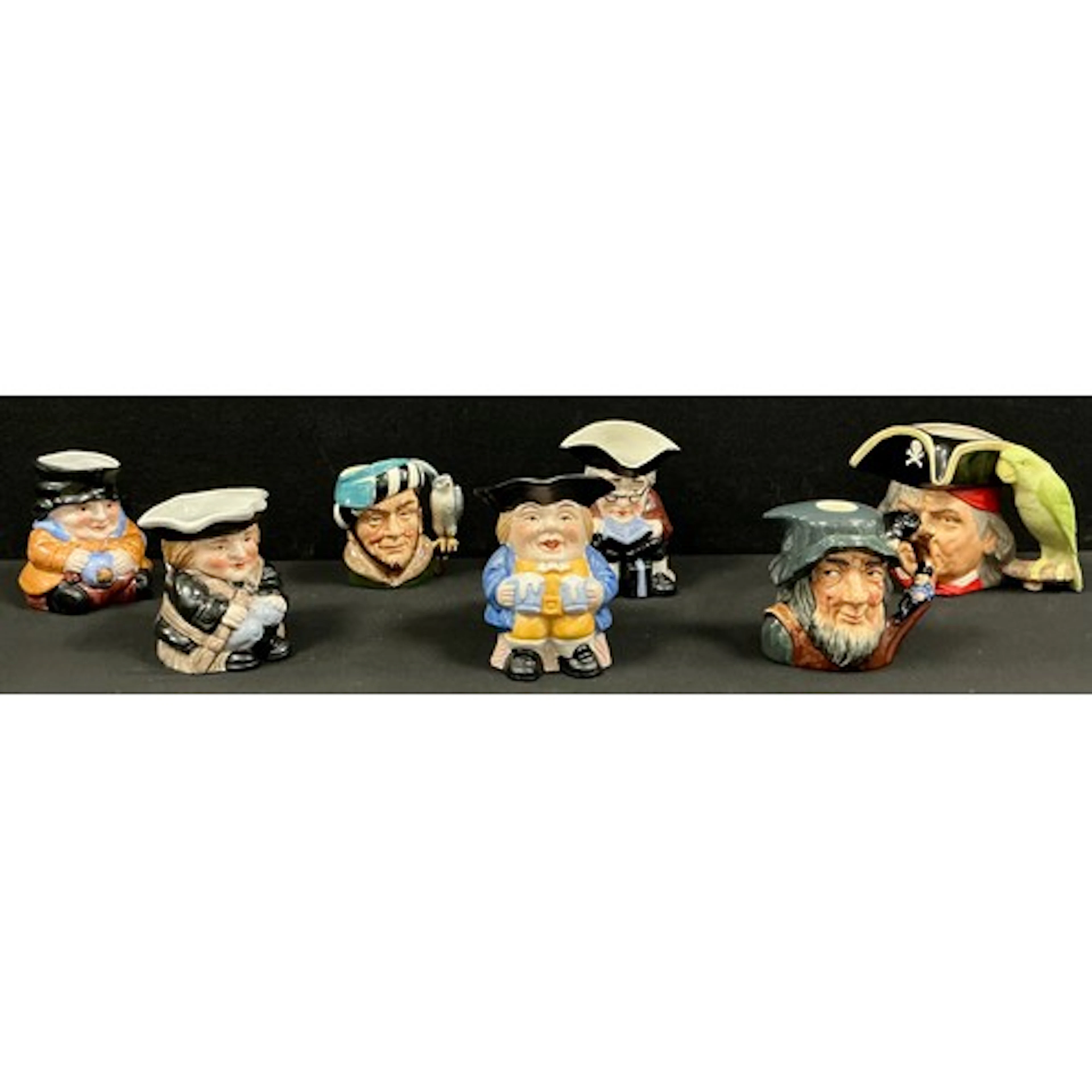 Royal Doulton toby jugs and other, a group of seven includin...
