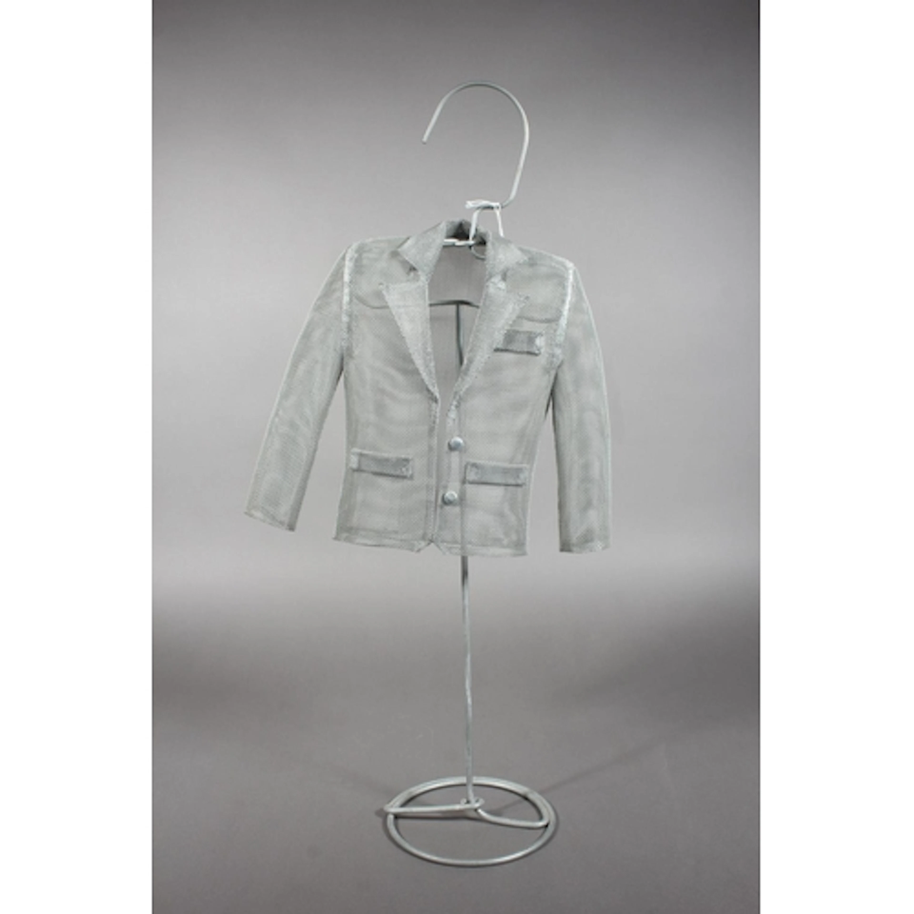 Modernist metal art sculpture in the form of a jacket on sta...