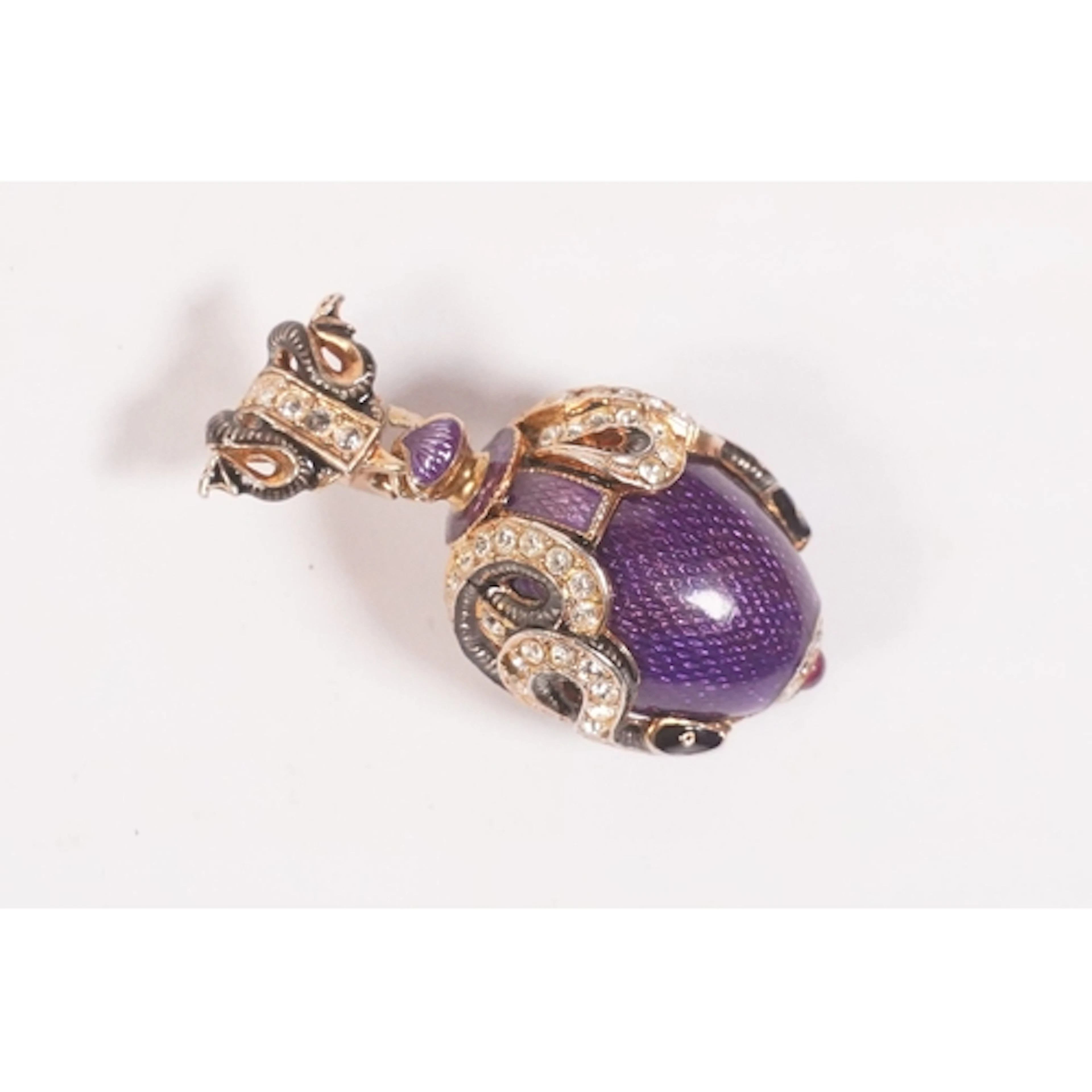 Faberge-inspired purple enamel guilloche egg pendant, having...