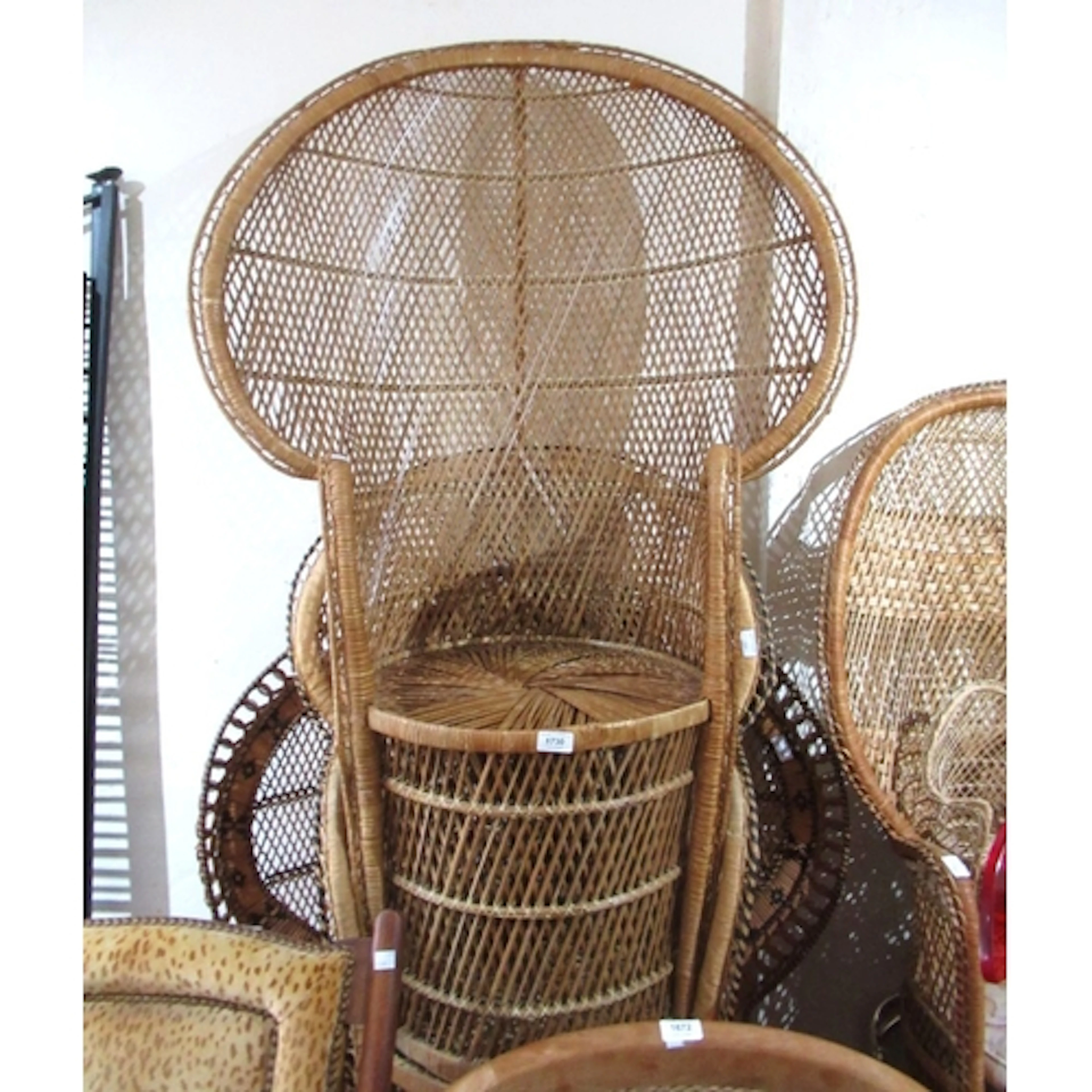 Four various mid 20th Century rattan peacock chairs, togethe...