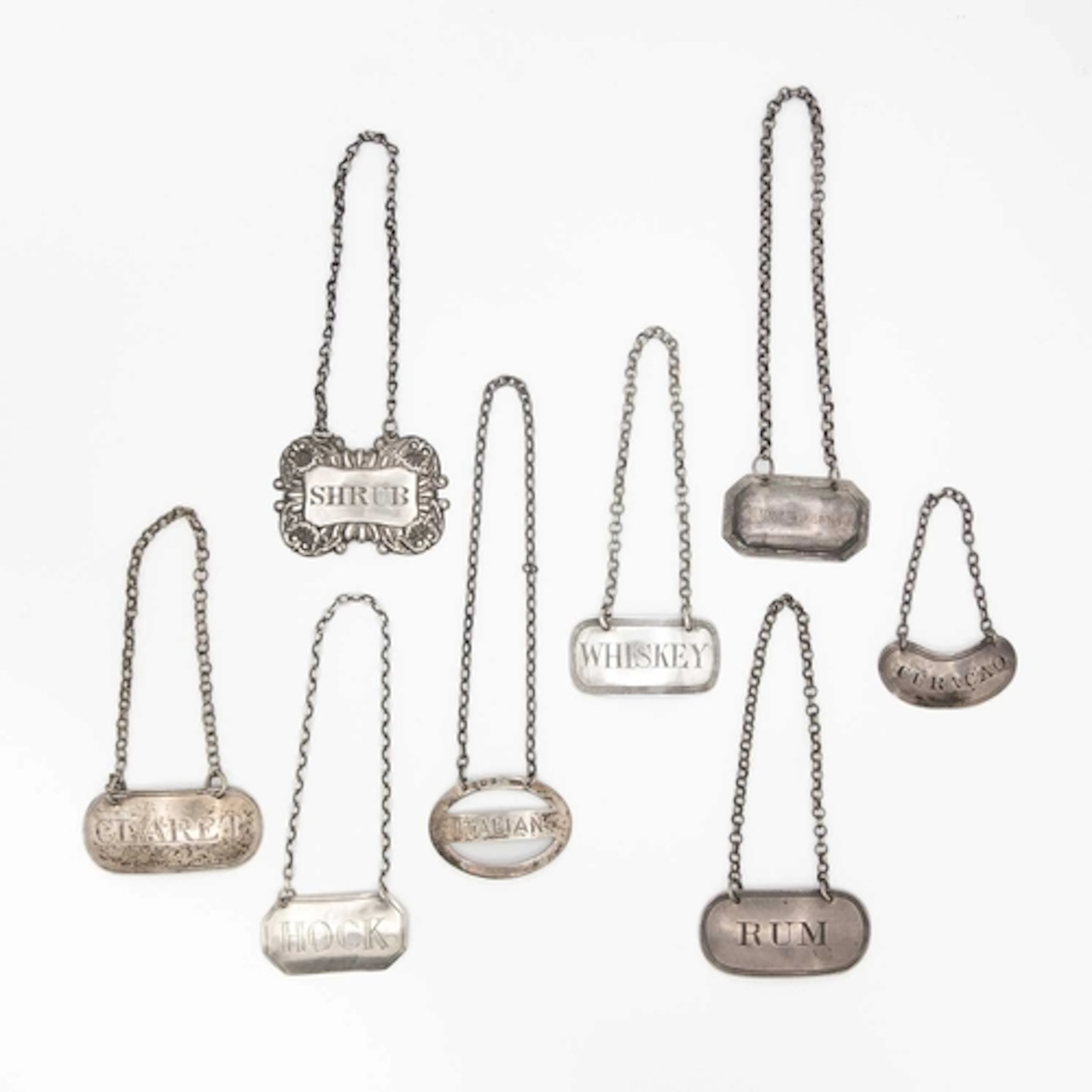 A selection of eight silver wine labels. Various makers incl...