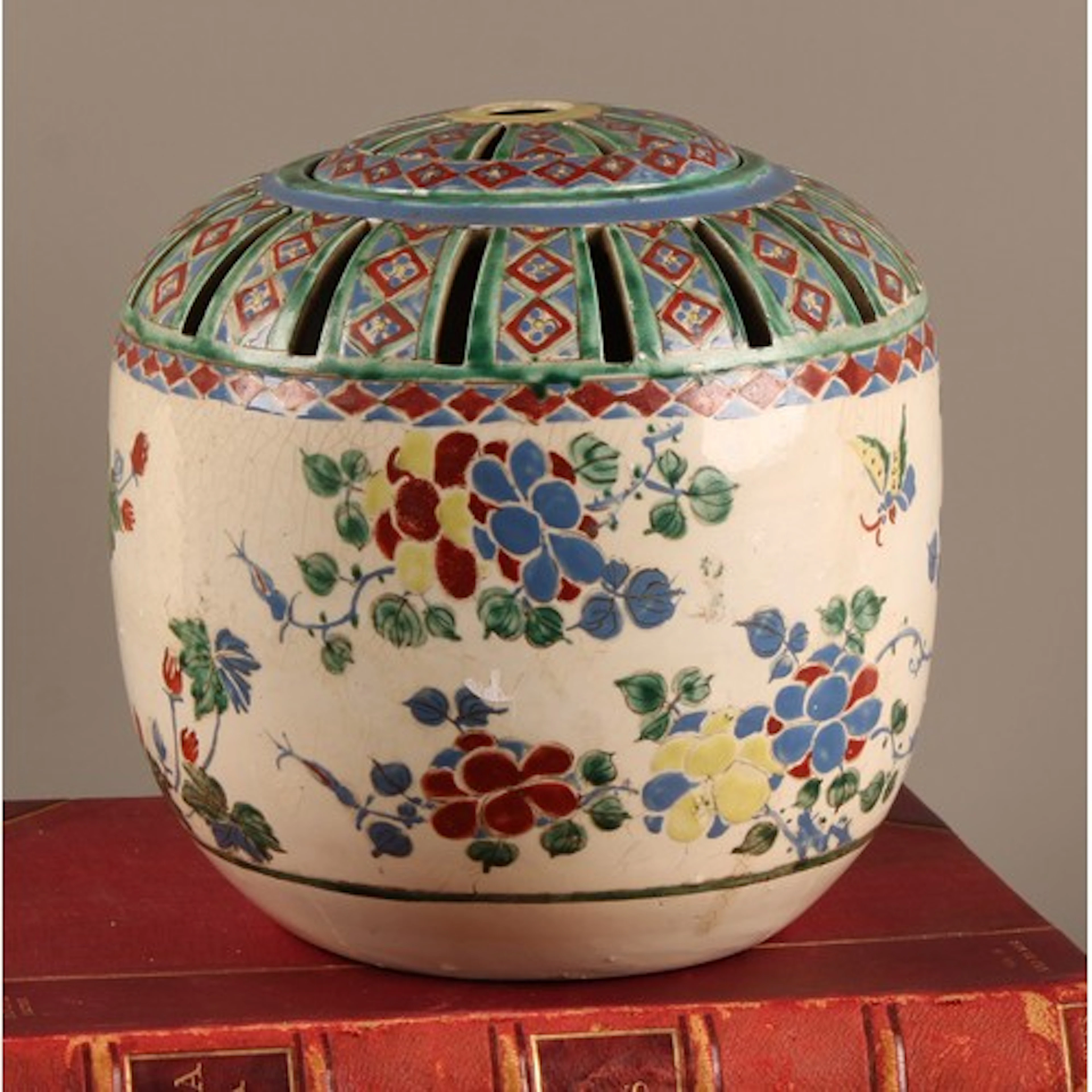 A Japanese potpourri vase and cover, decorated in the Kakiem...