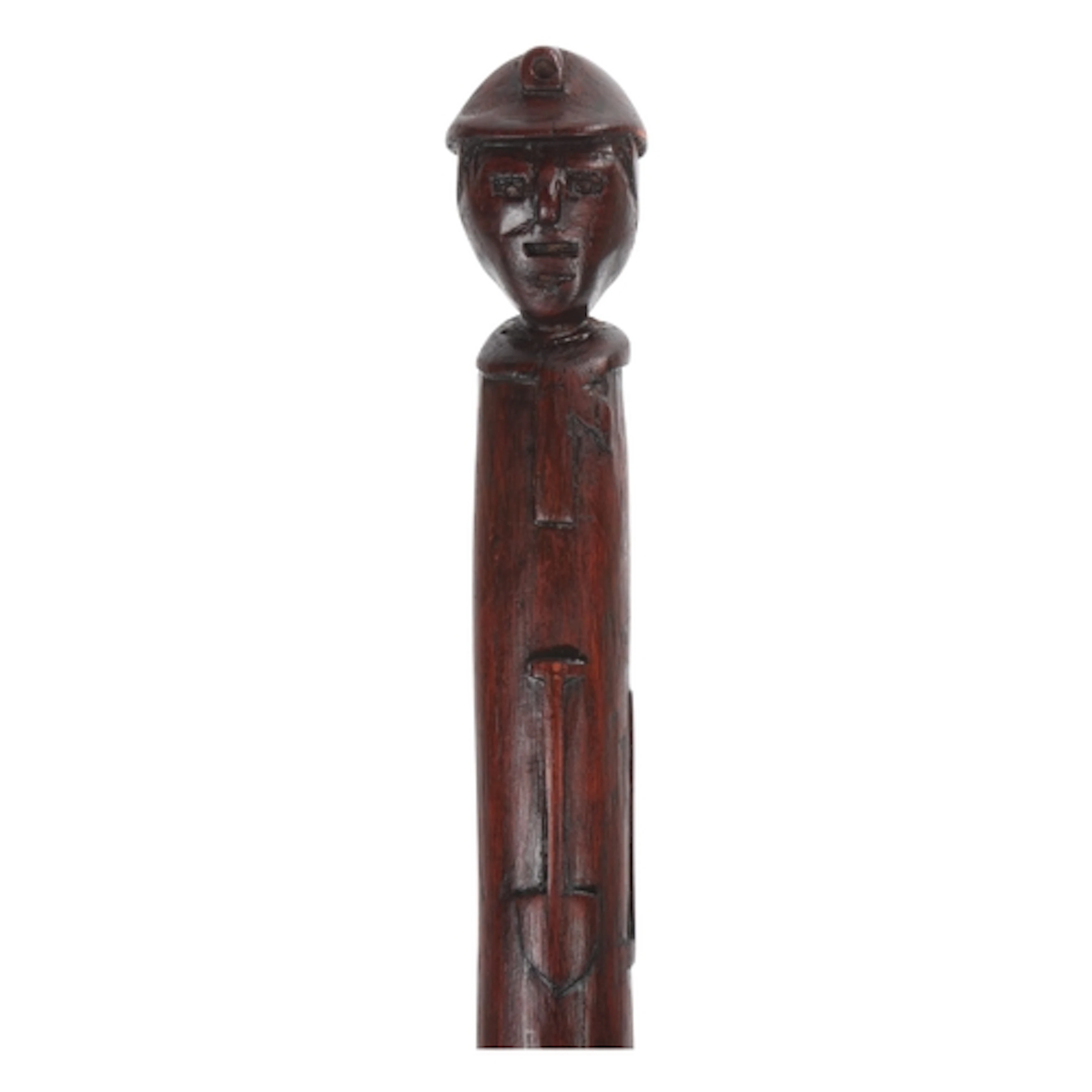 A one-piece Folk Art colliers’ cane, the top carved as a hel...