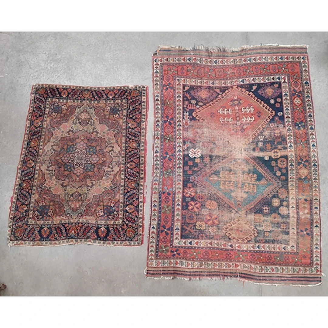 A Persian style Rug on beige ground with floral borders with...