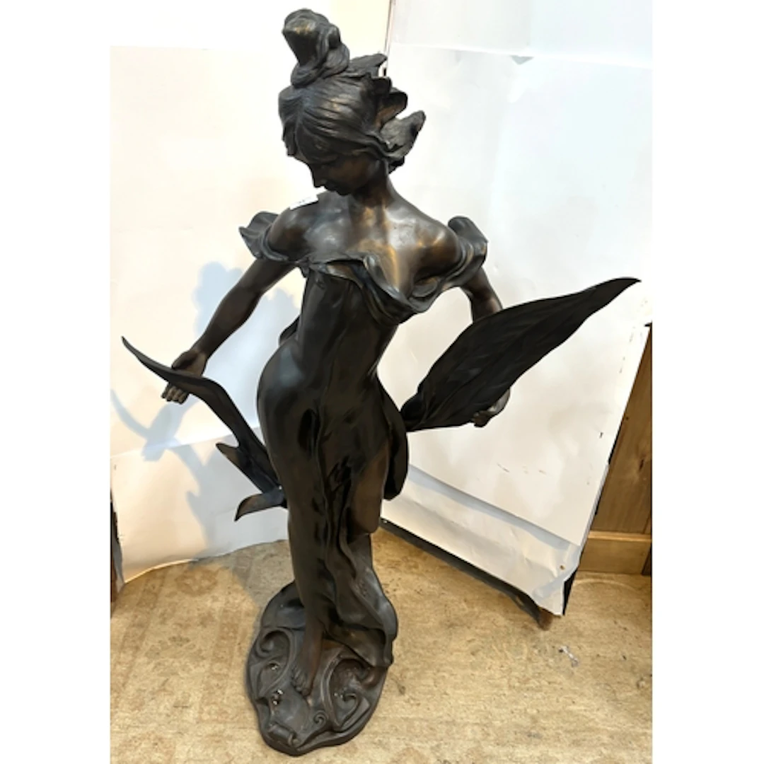 E Rossi: a modern half length bronze of a young woman with p...