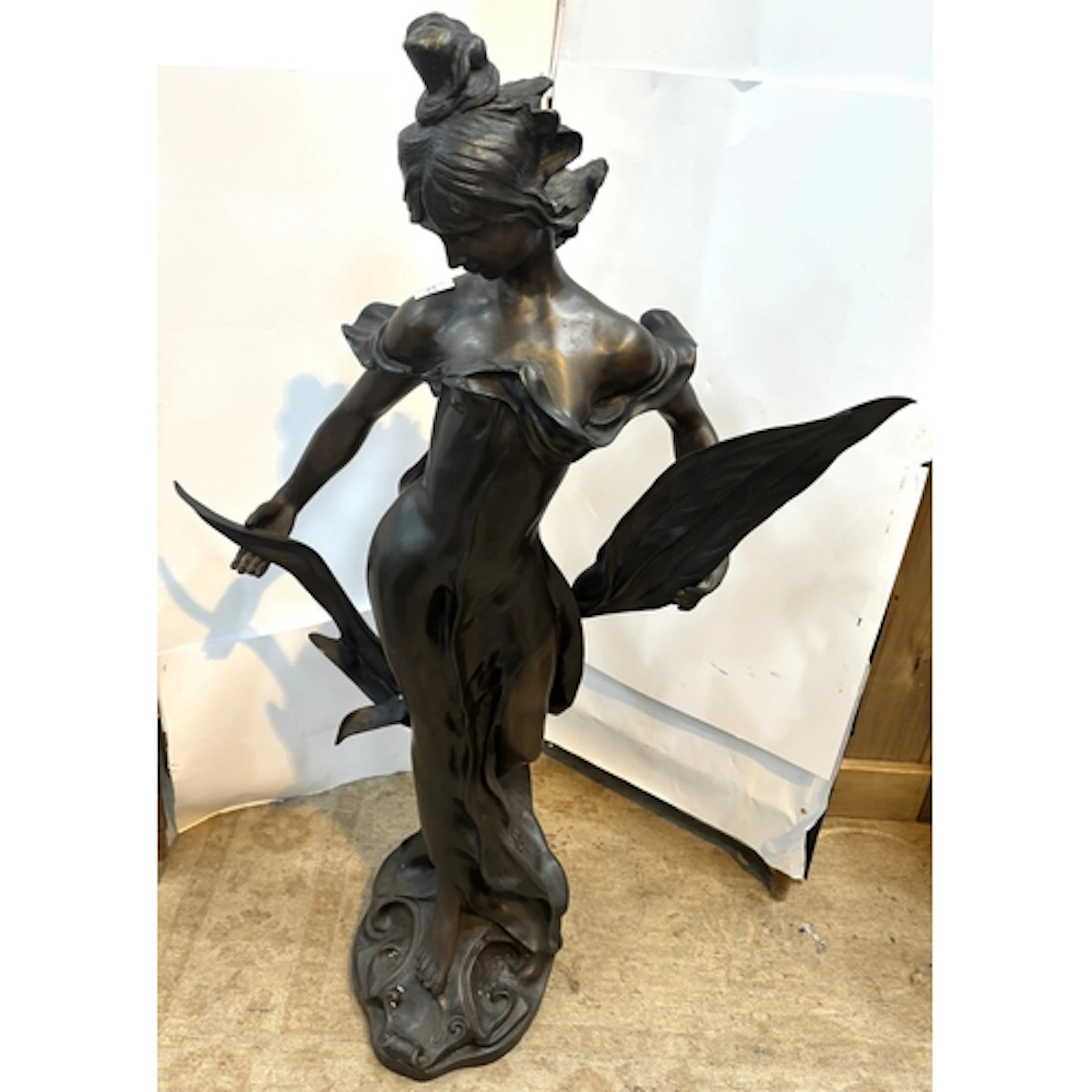 E Rossi: a modern half length bronze of a young woman with p...