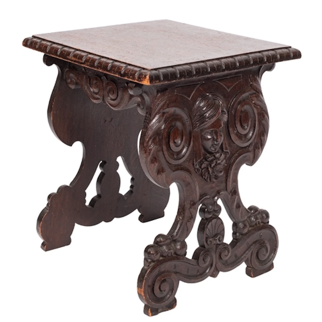 An Italian carved and stained oak stool in Renaissance taste...