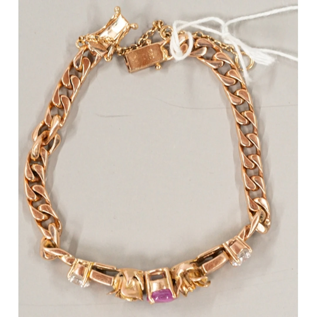 Jewellery: a rose metal curb link bracelet, marked 585 and t...