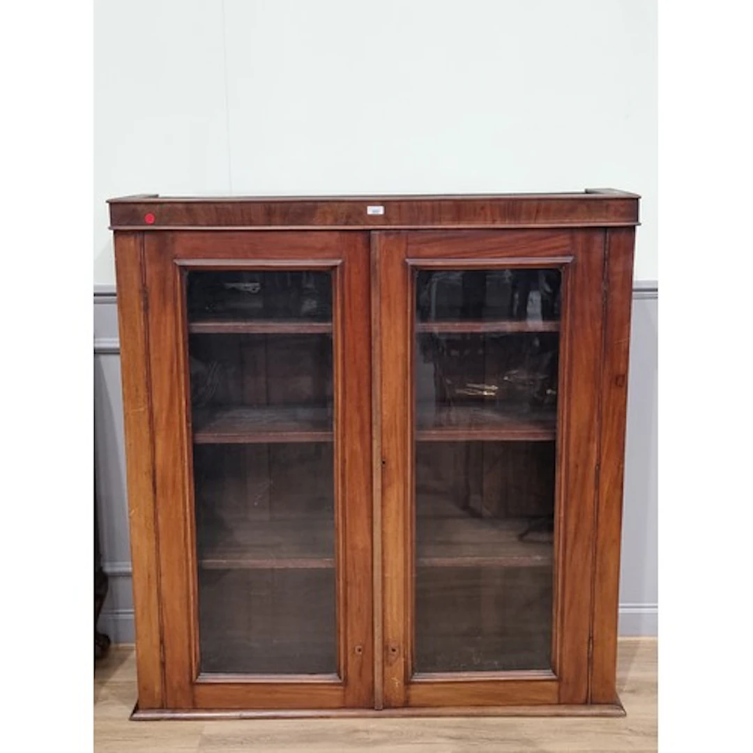 A mahogany glazed two door Cupboard with shelved interior, 4...