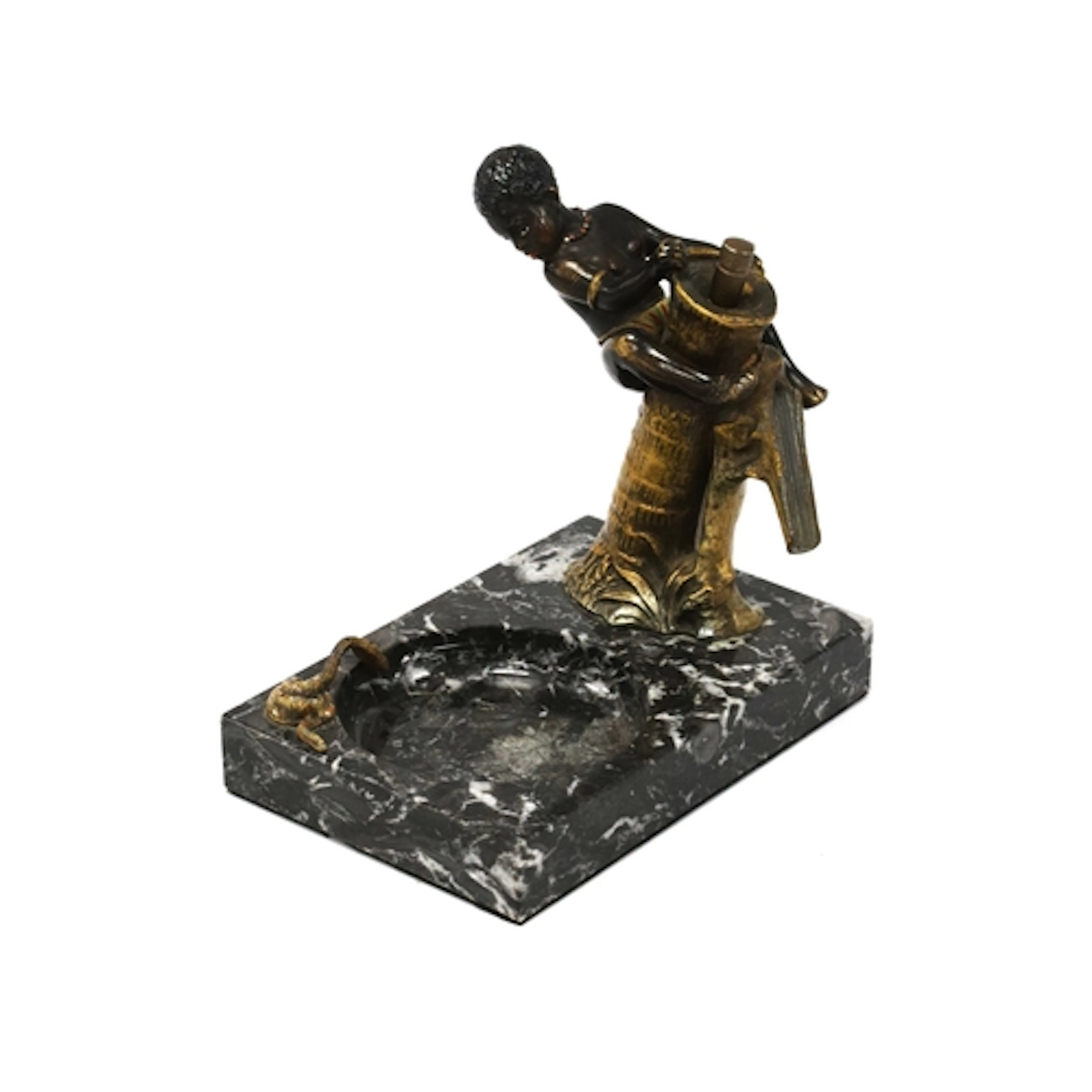 A Speltre Ashtray/Table Lighter, cast in the form of an Afri...