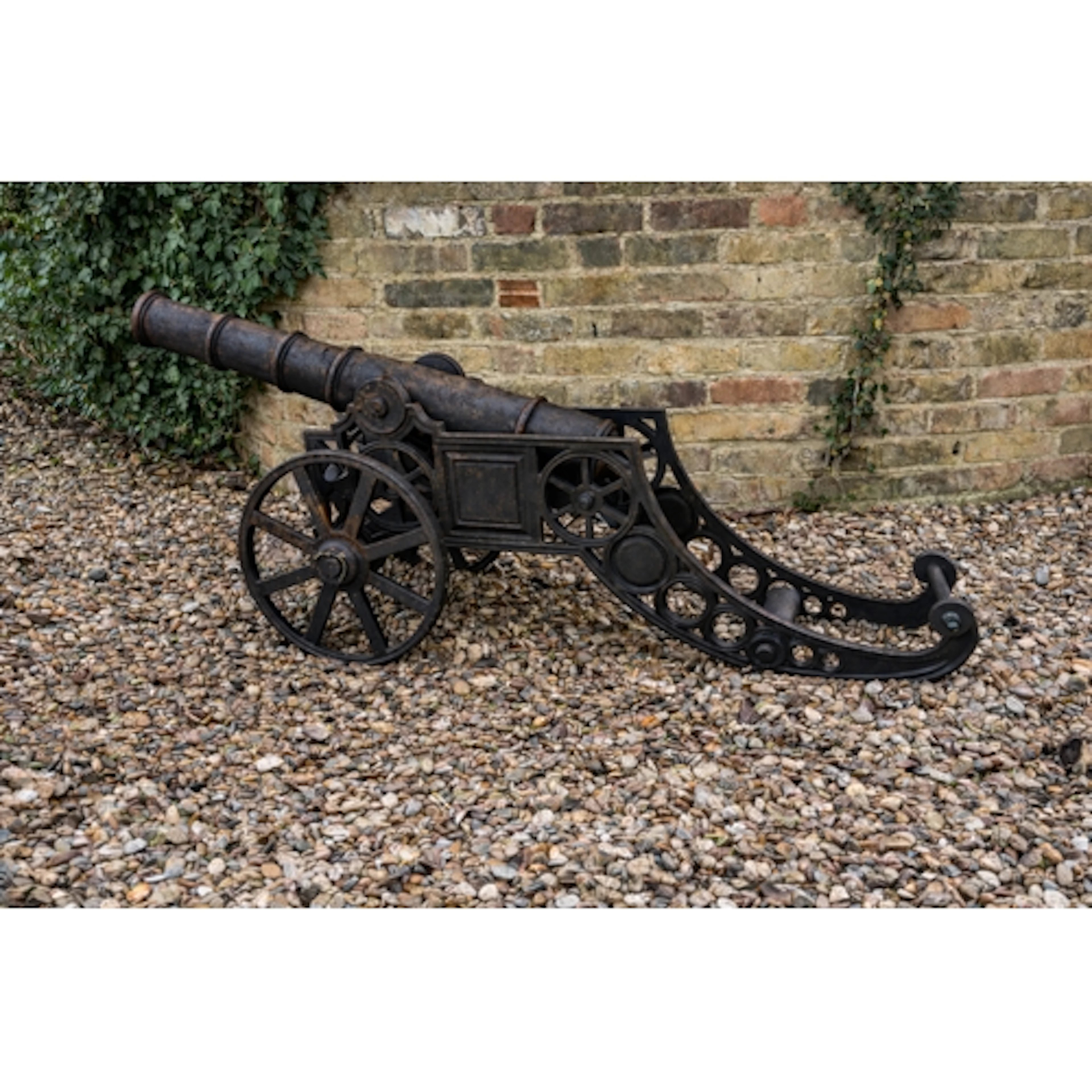 A magnificent and highly decorative cast iron cannon cast in...
