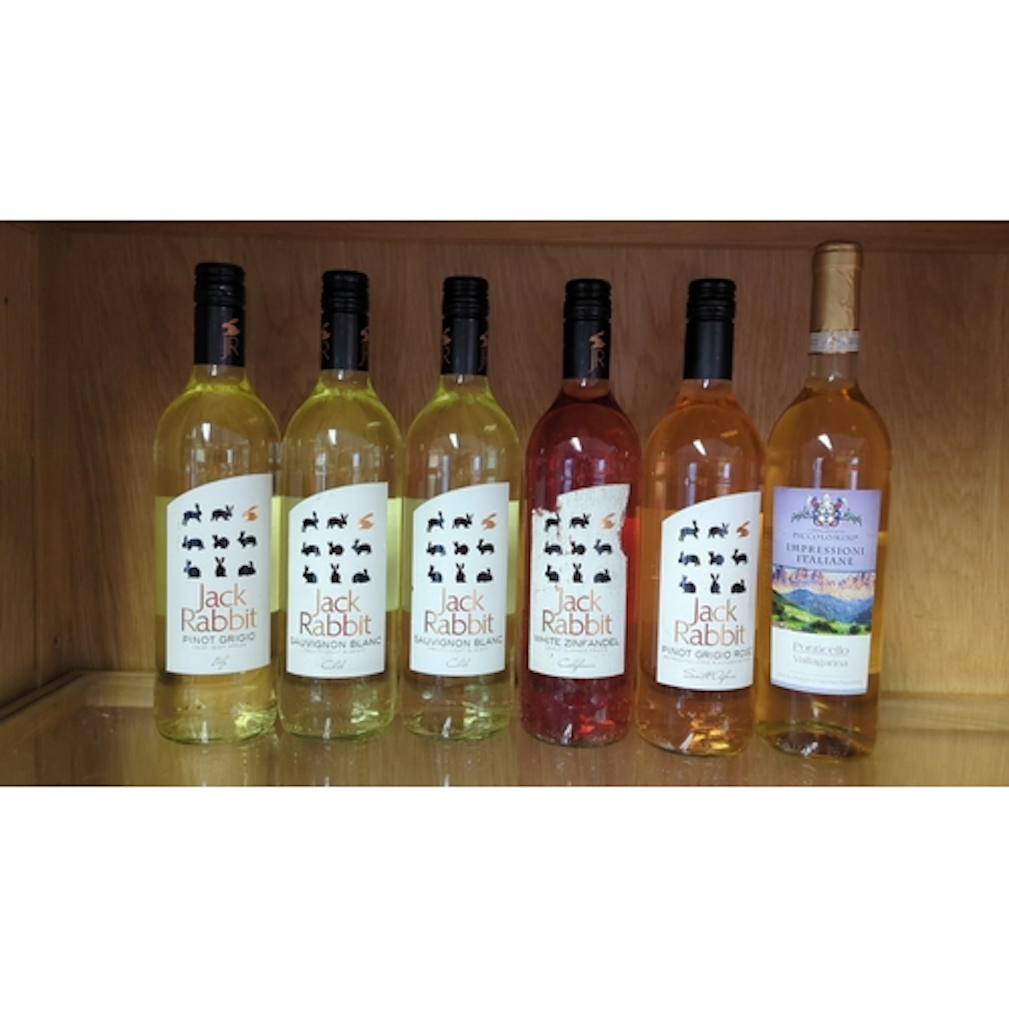 A collection of six bottled table wines, including Jack Rabb...