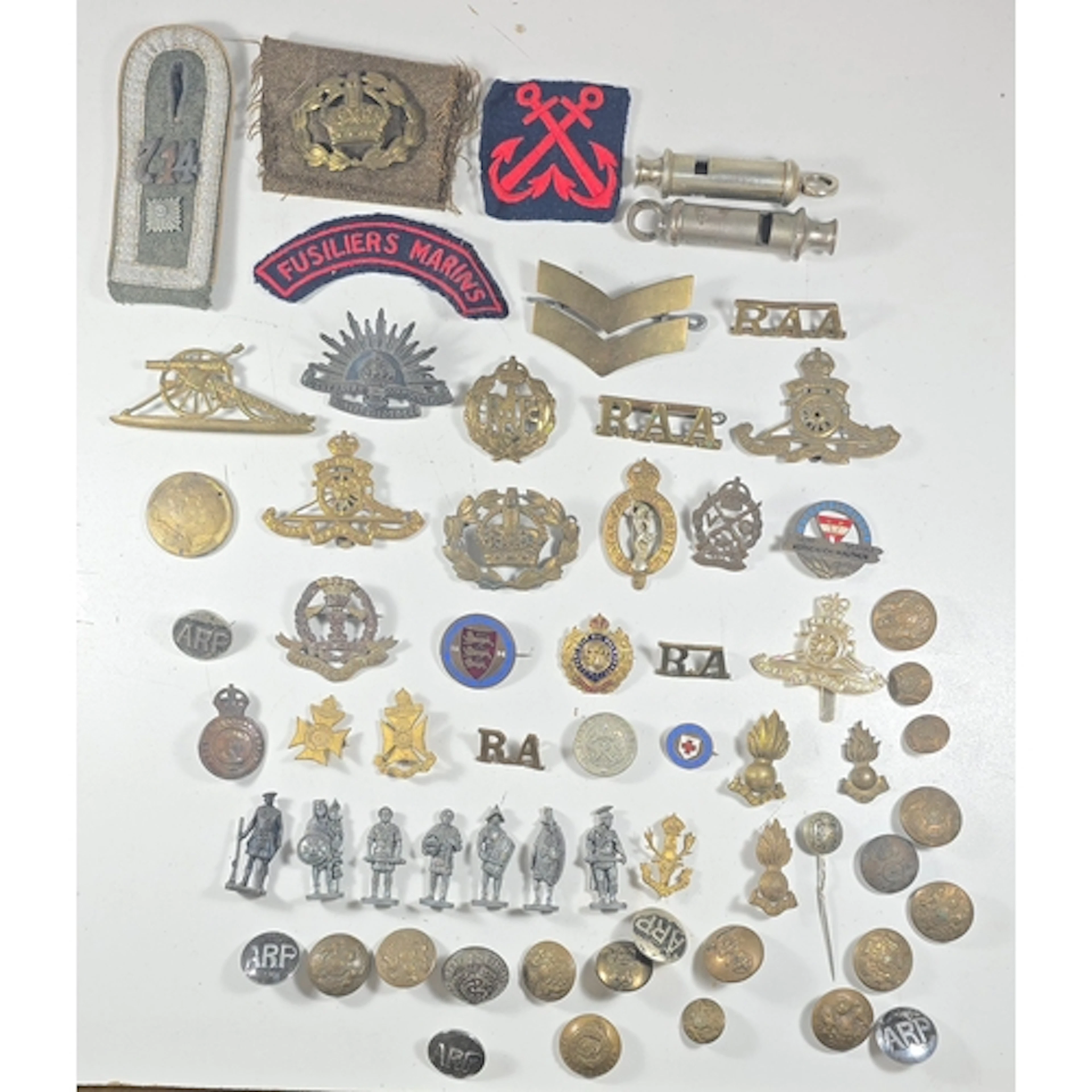 Quantity of military badges and 2 whistles (one dated 1938) ...