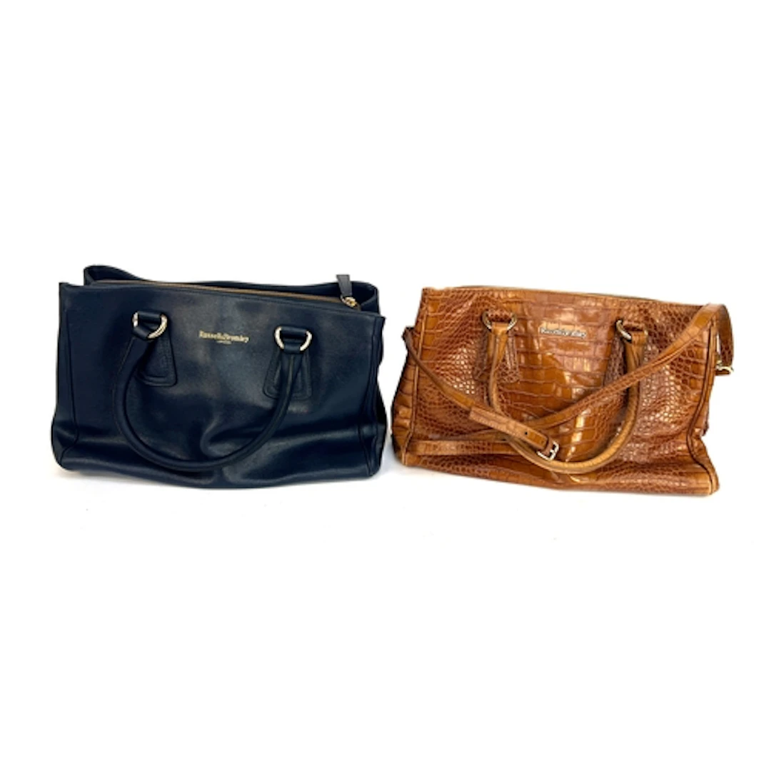 Two Russell & Bromley leather handbags, one navy the other b...