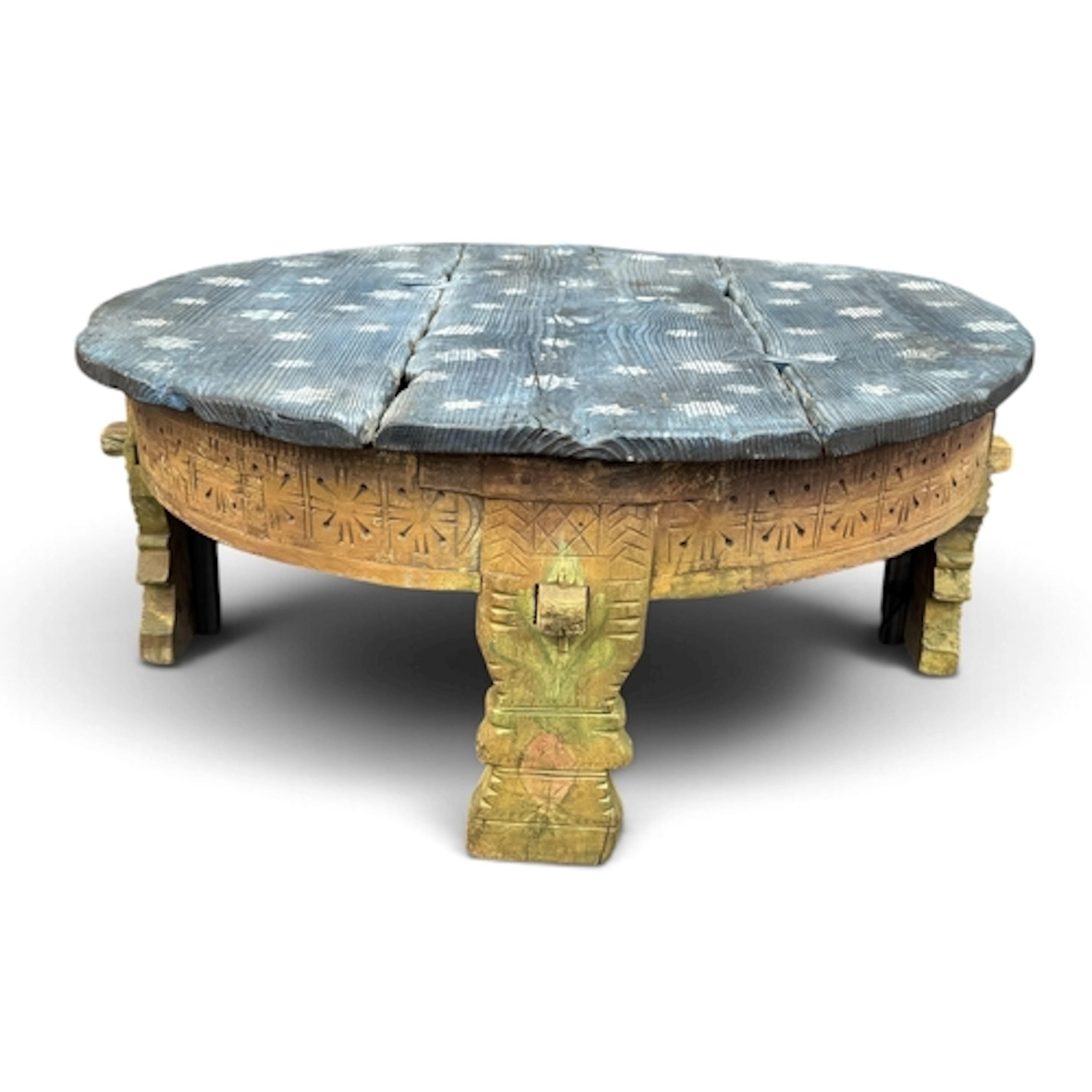 AN INDIAN CARVED AND PAINTED LOW TABLE The circular top of ...