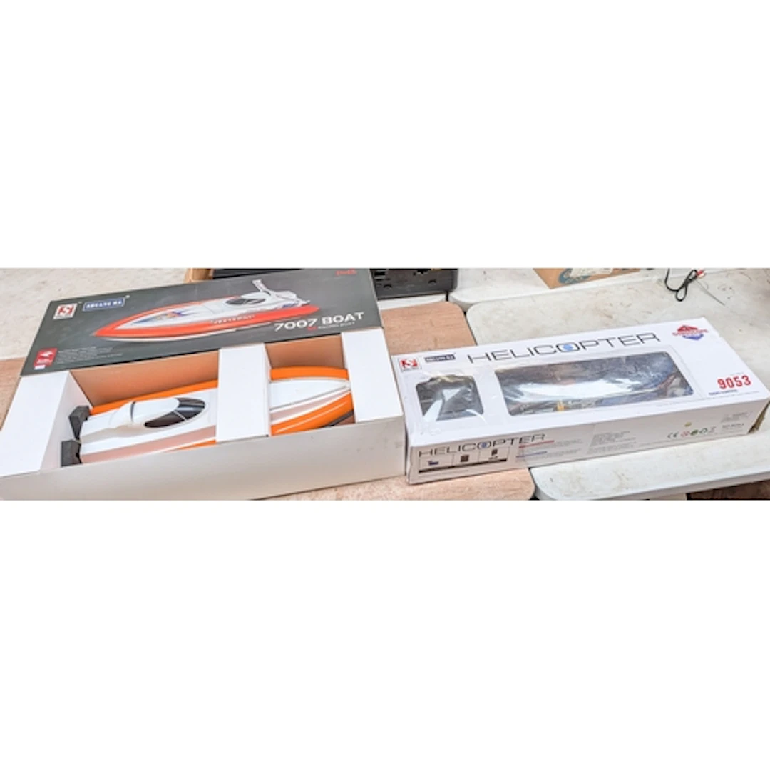 Radio controlled 7007 racing boat and a radio controlled hi ...
