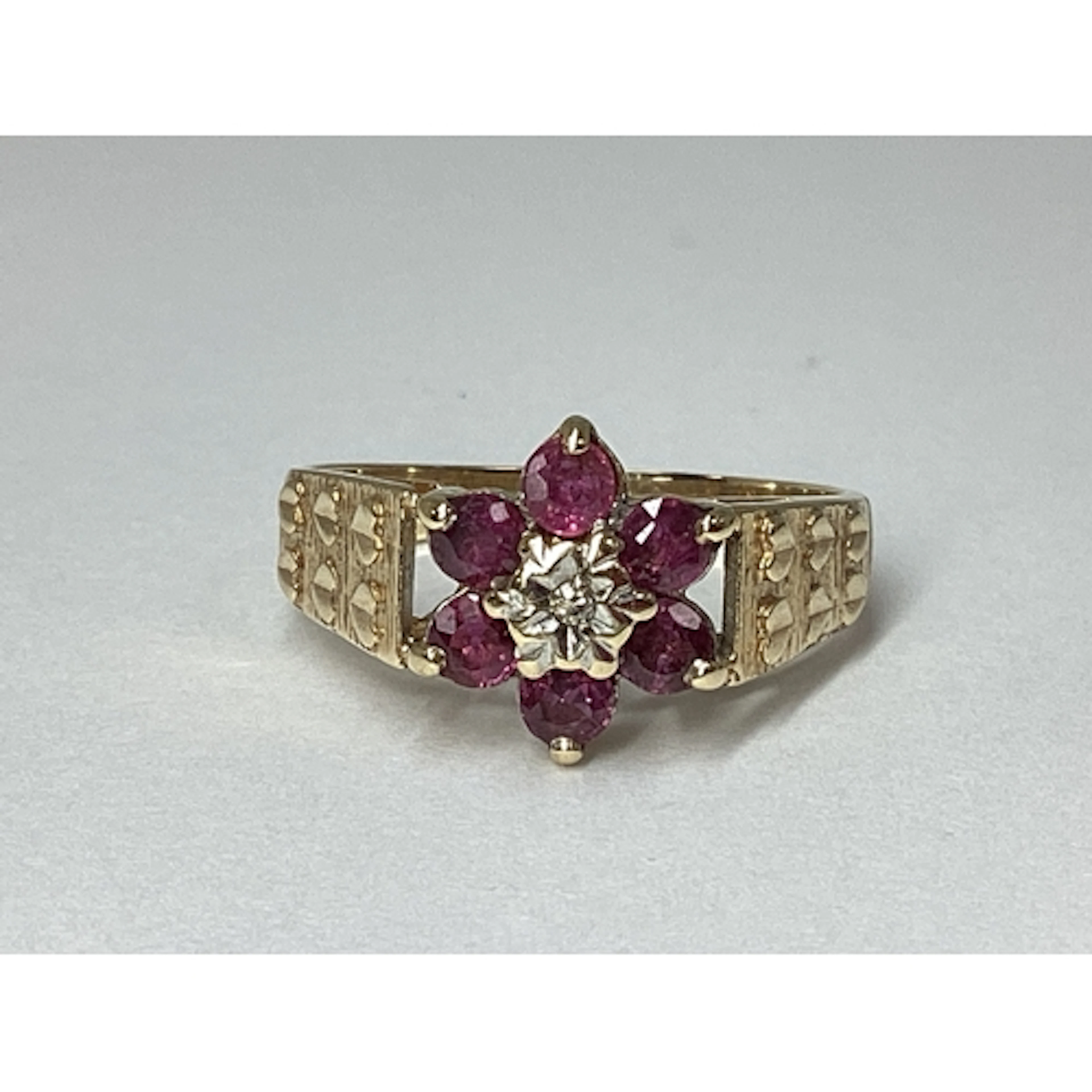 A Decorative Claw Set Cluster Ring, of flowerhead design, be...