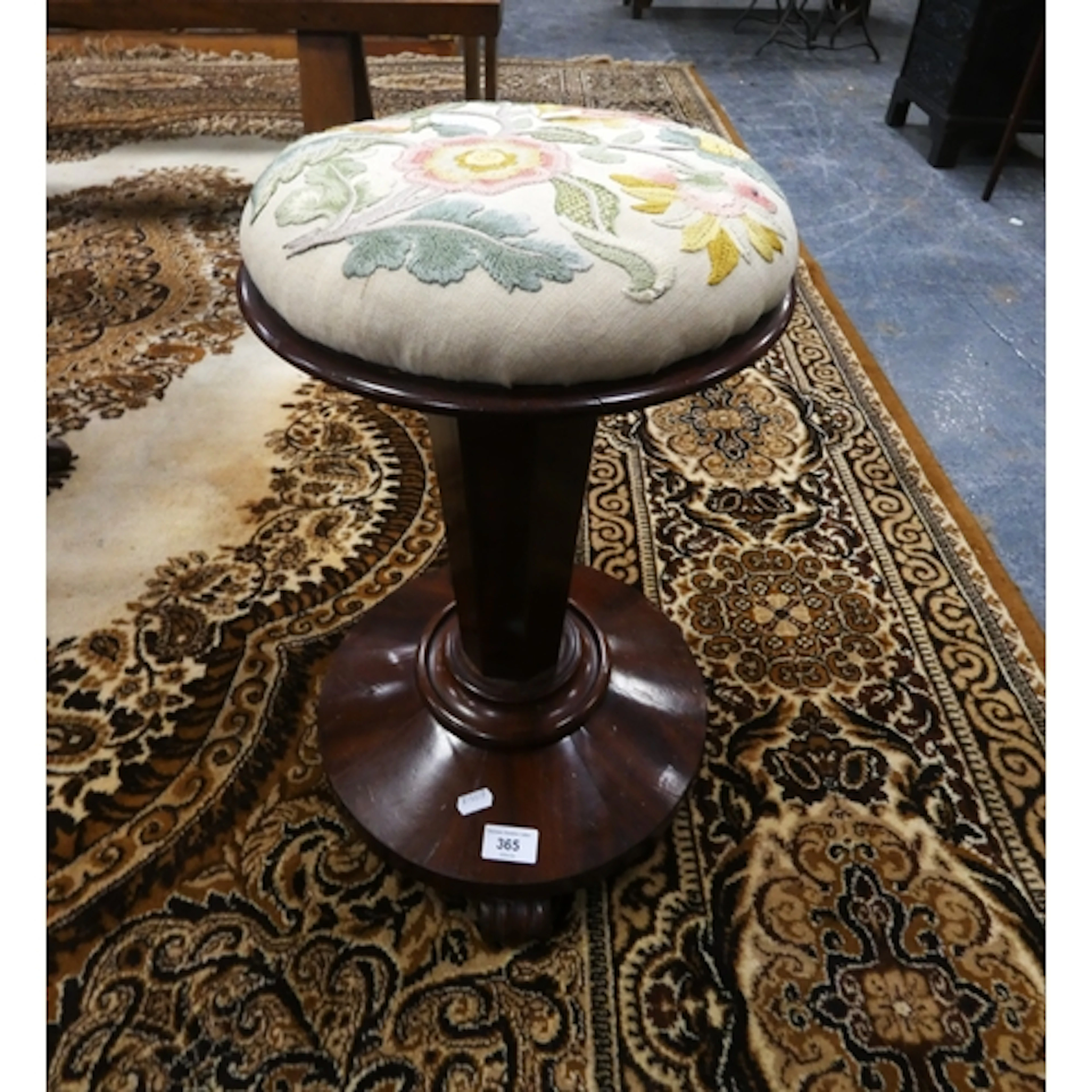 Antique mahogany revolving piano stool.
