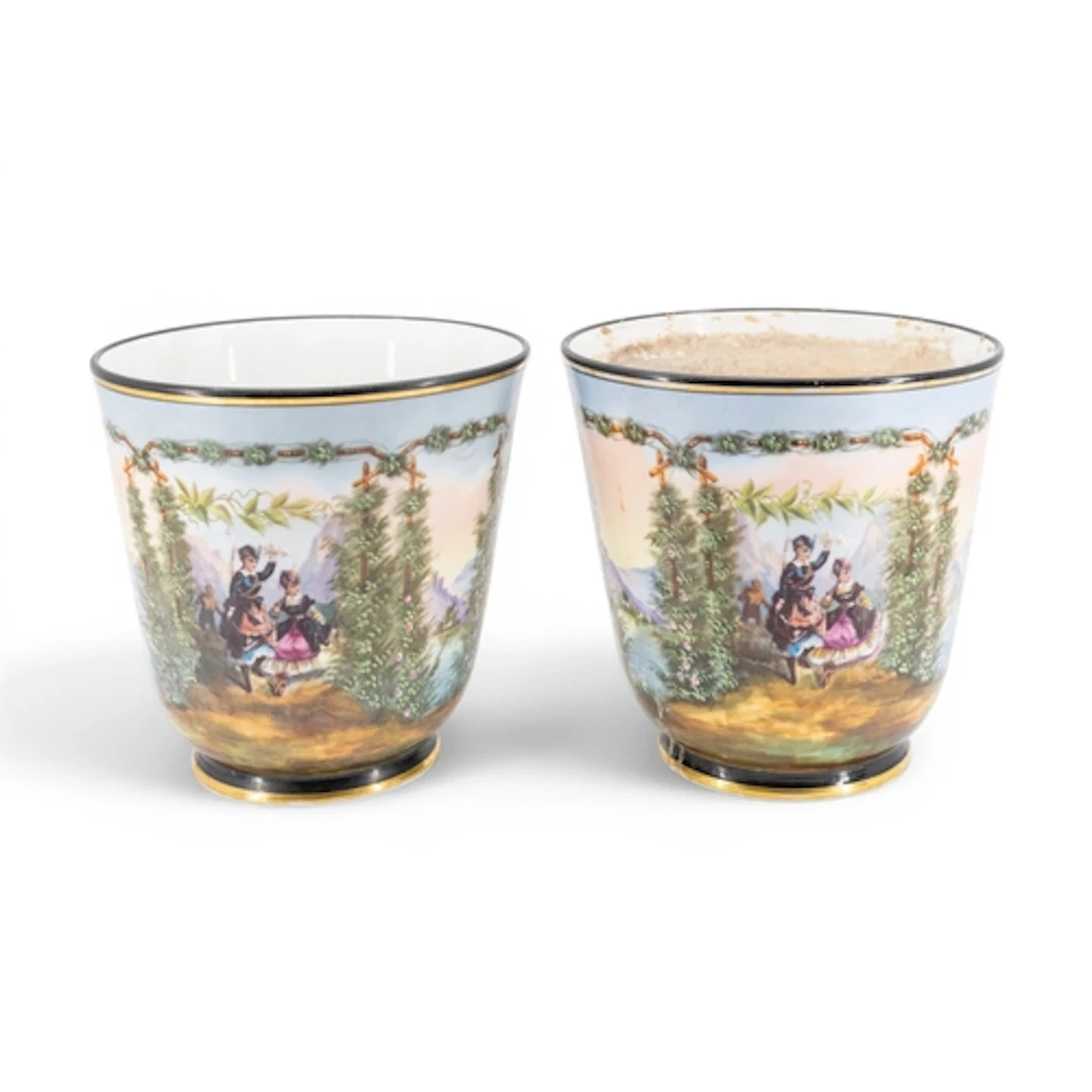 A PAIR OF CONTINENTAL PORCELAIN JARDINIERES hand painted wit...