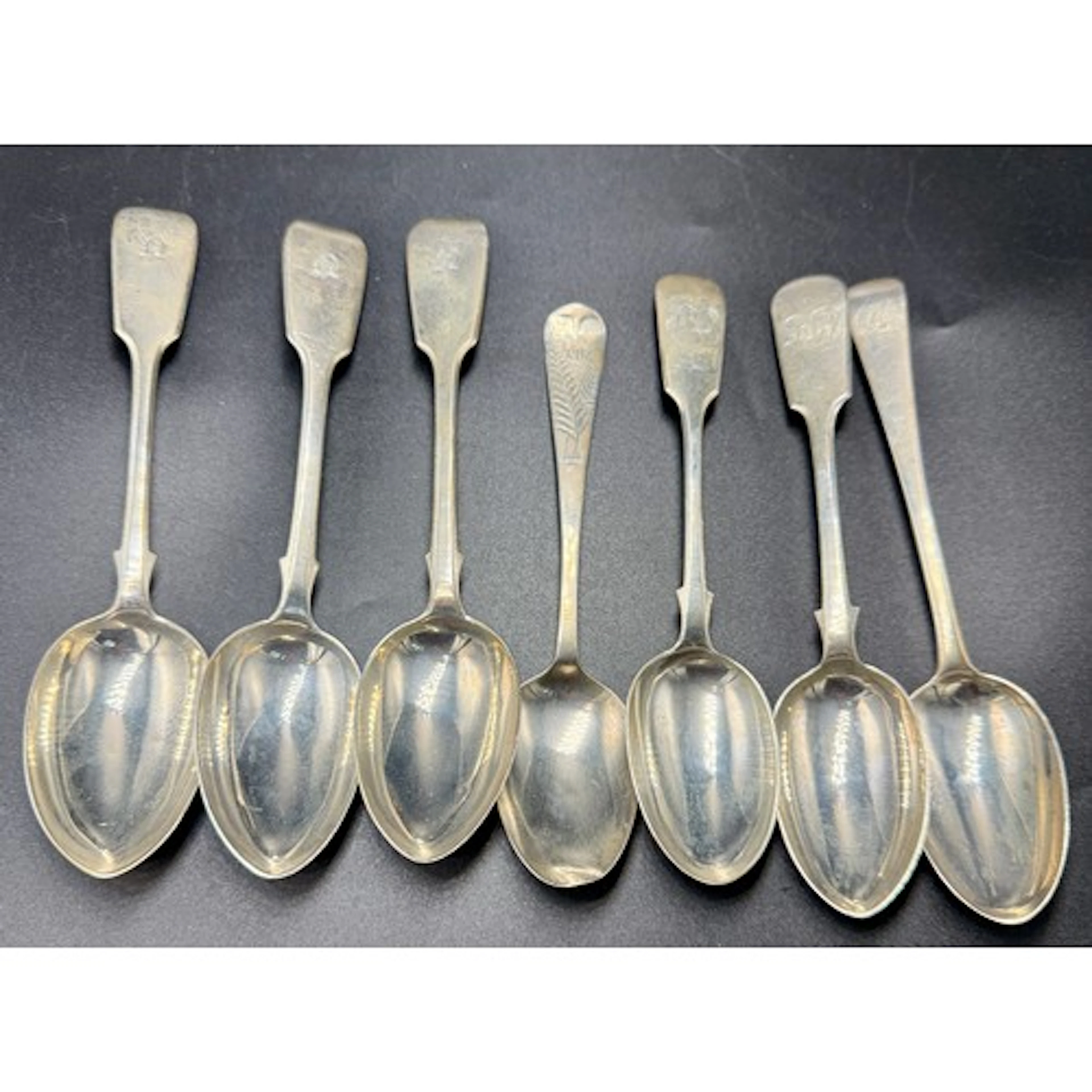 Seven Exeter silver dessert spoons to include five by Josiah...