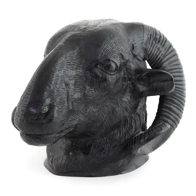 Black painted cast iron ram's head wall mask, 18cm high.