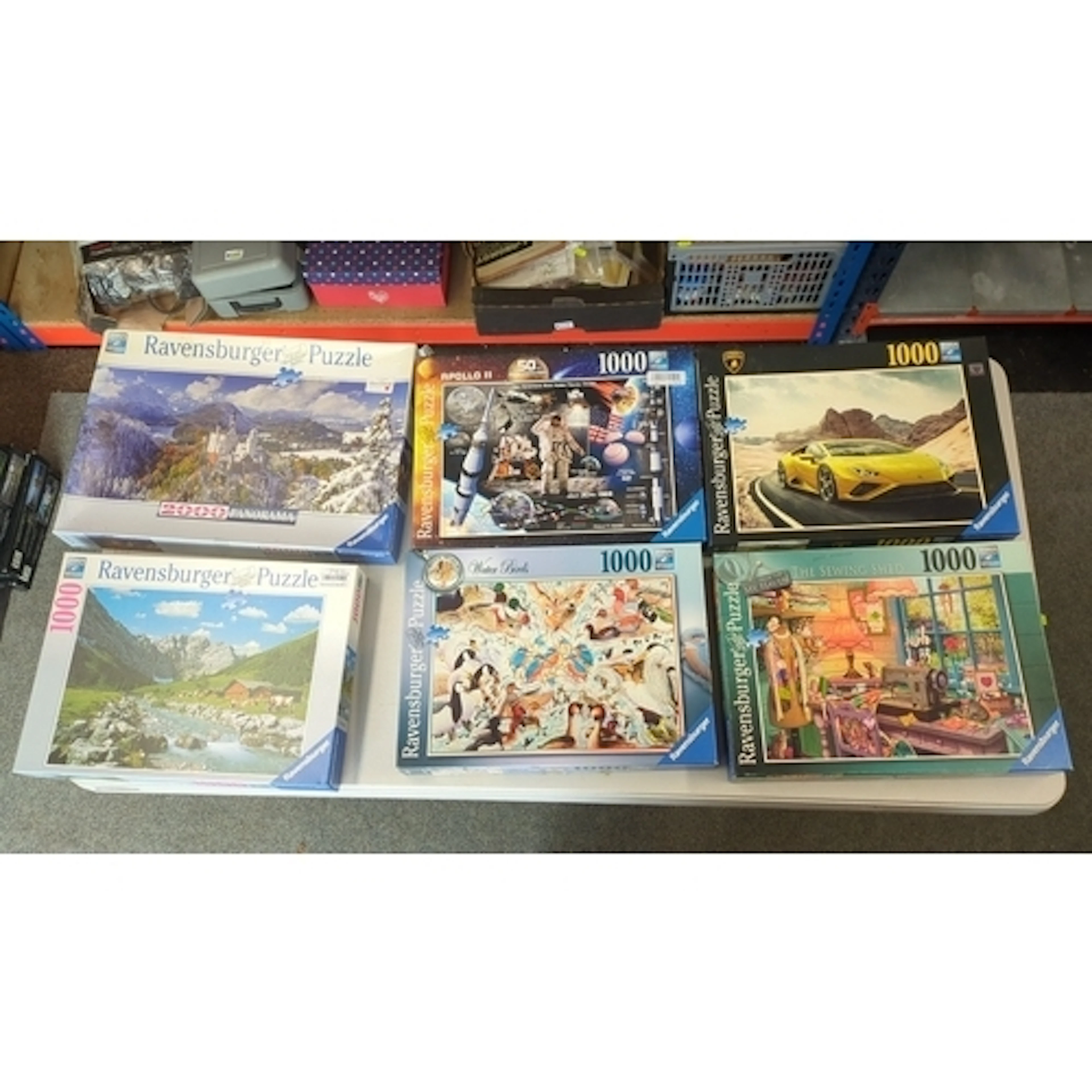 A group of boxed Ravensburger jigsaw puzzles, including 1000...