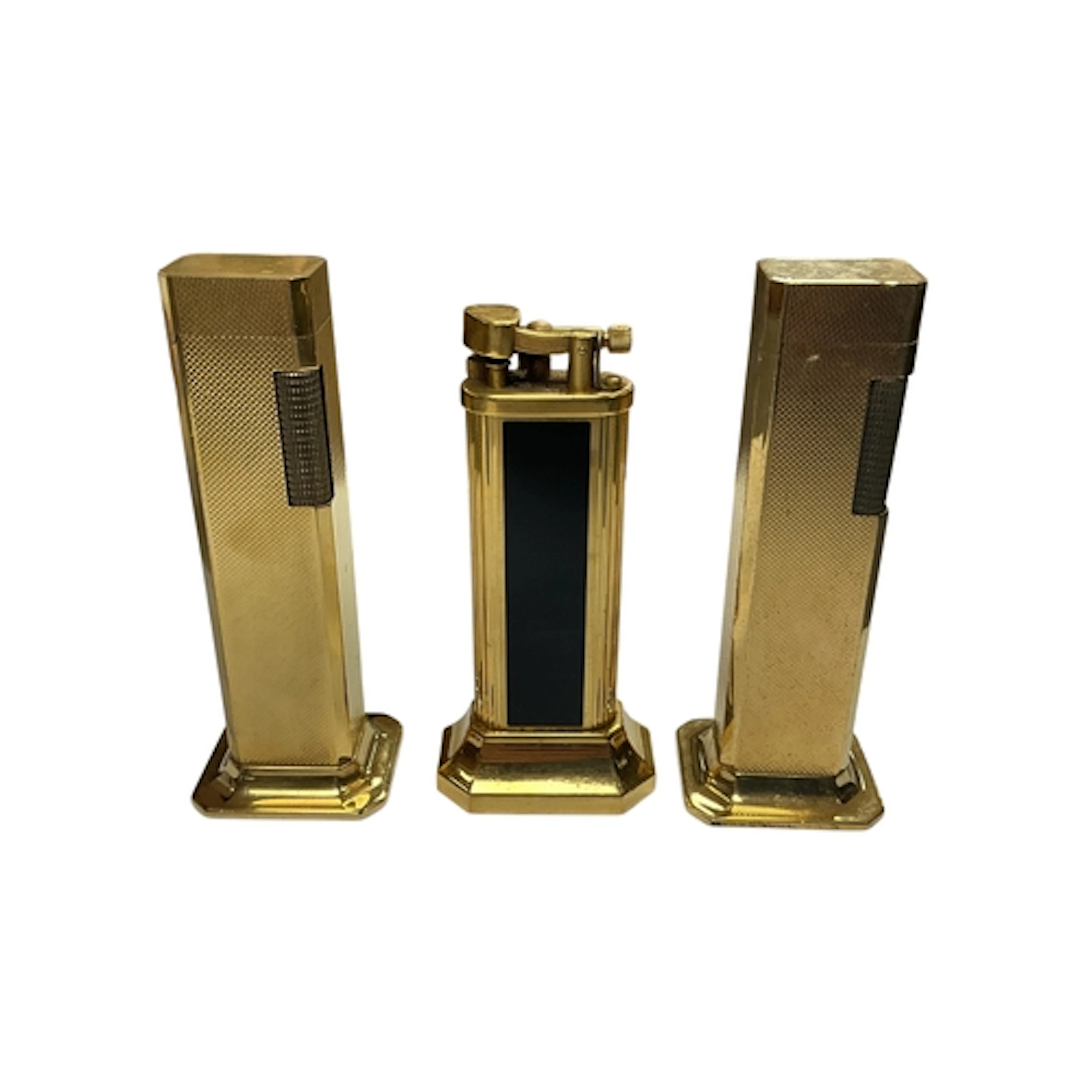 Two Dunhill Tallboy gilt-metal table lighters, together with...