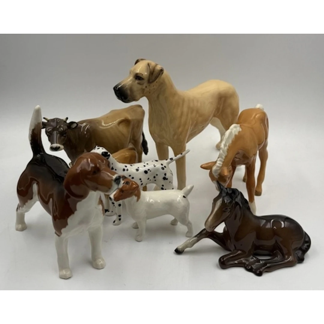 A selection of Beswick animals to include cows, horses and a...