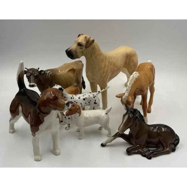 A selection of Beswick animals to include cows, horses and a...