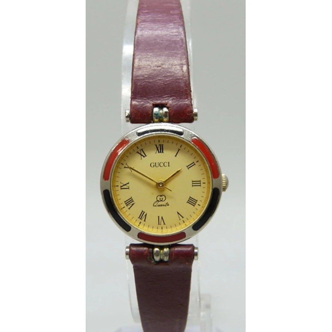 A lady's vintage Gucci wristwatch with enamel bezel, 24mm in...