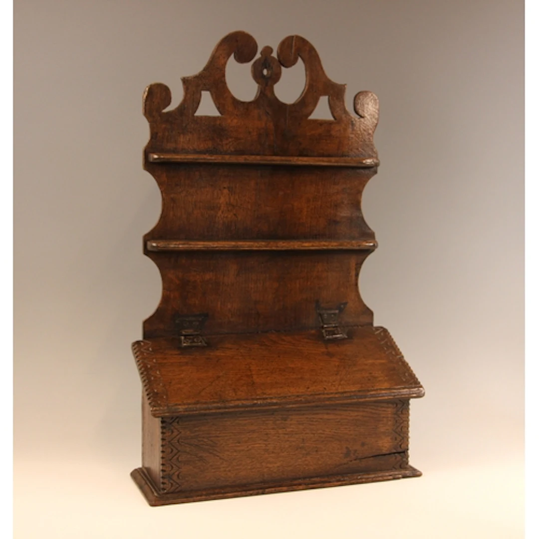 A Welsh oak spoon rack and cutlery box, 19th century, the sh...
