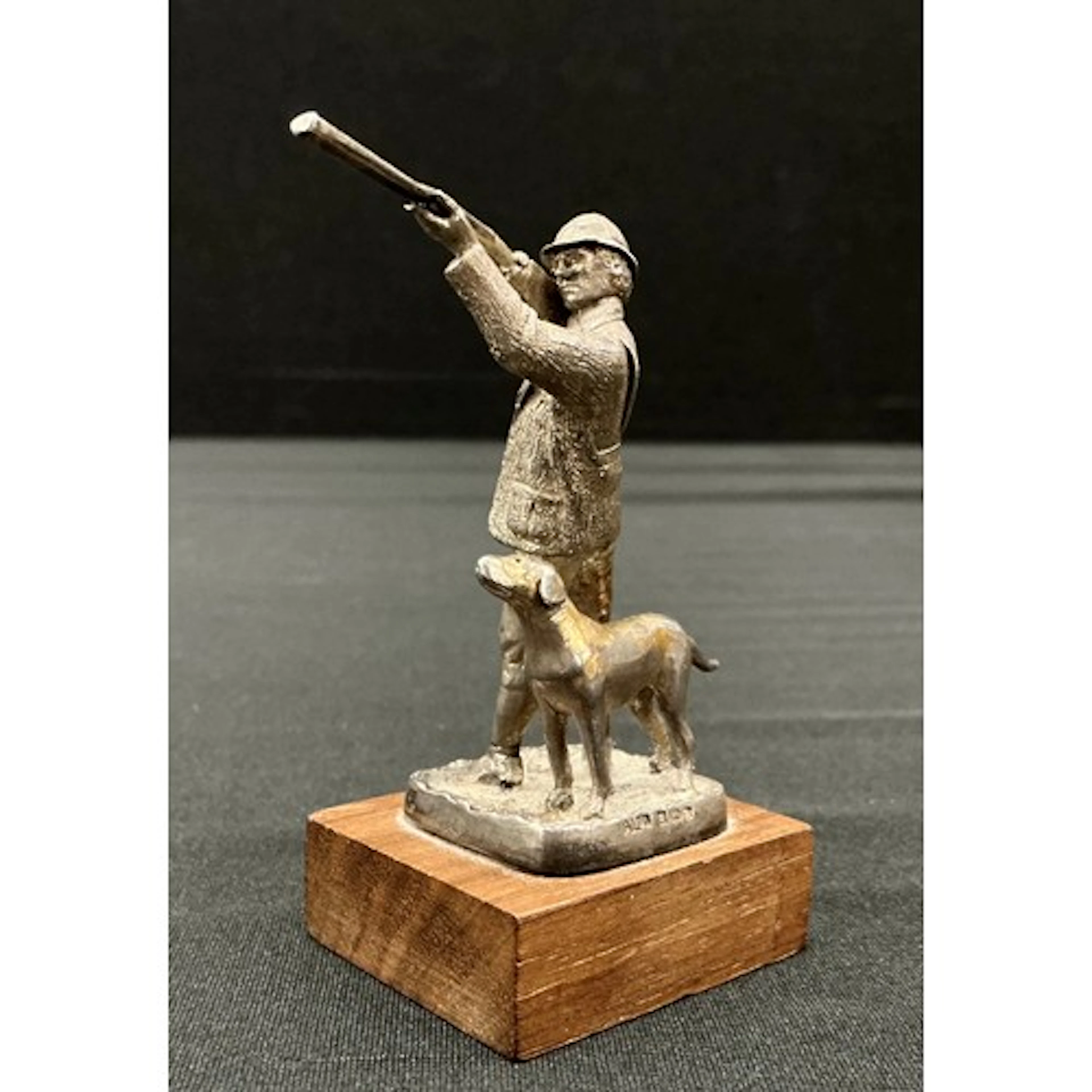 A Silver figure of a hunter with hound, Birmingham, 1978, ha...
