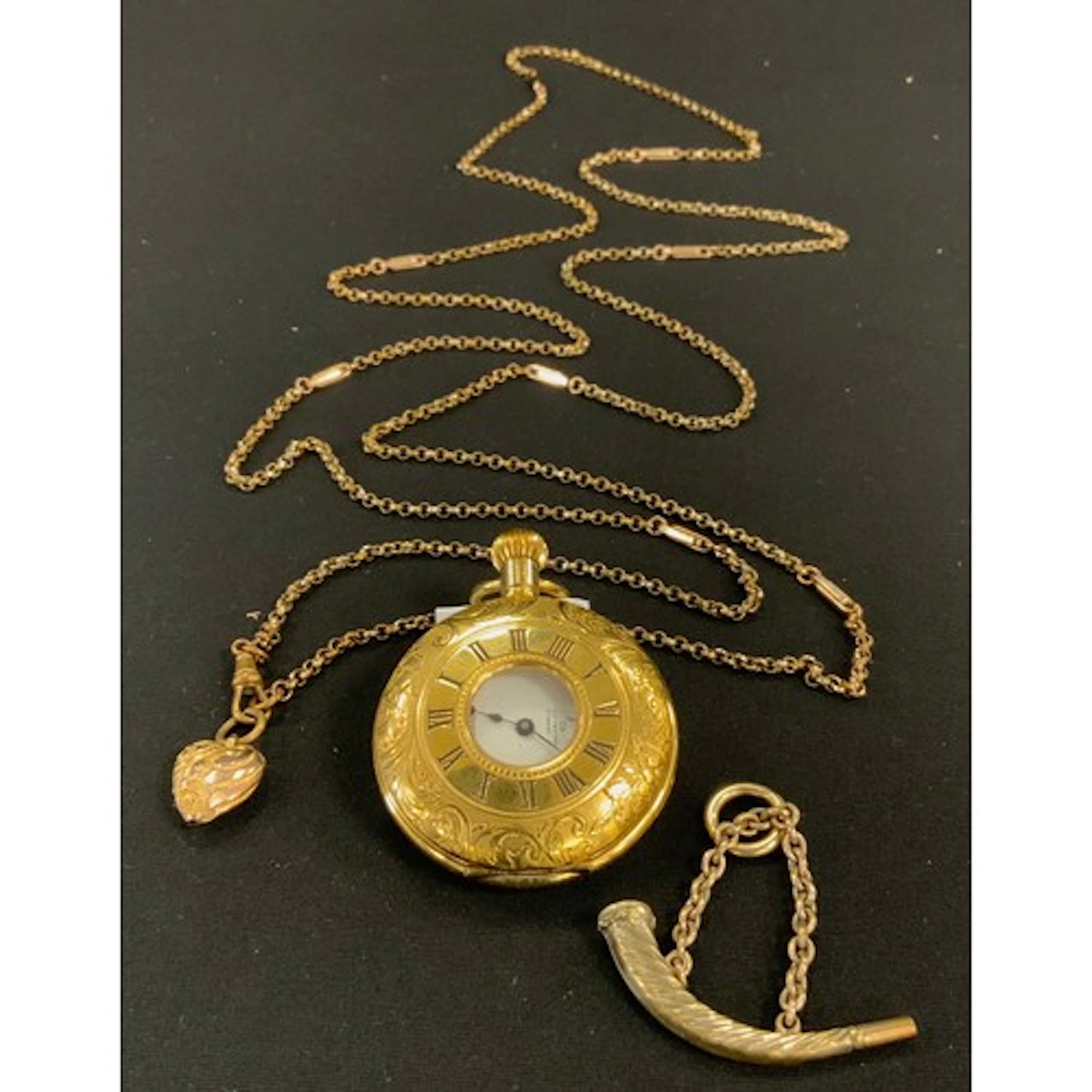 A Fancy link gold filled guard chain, stamped warranted gold...