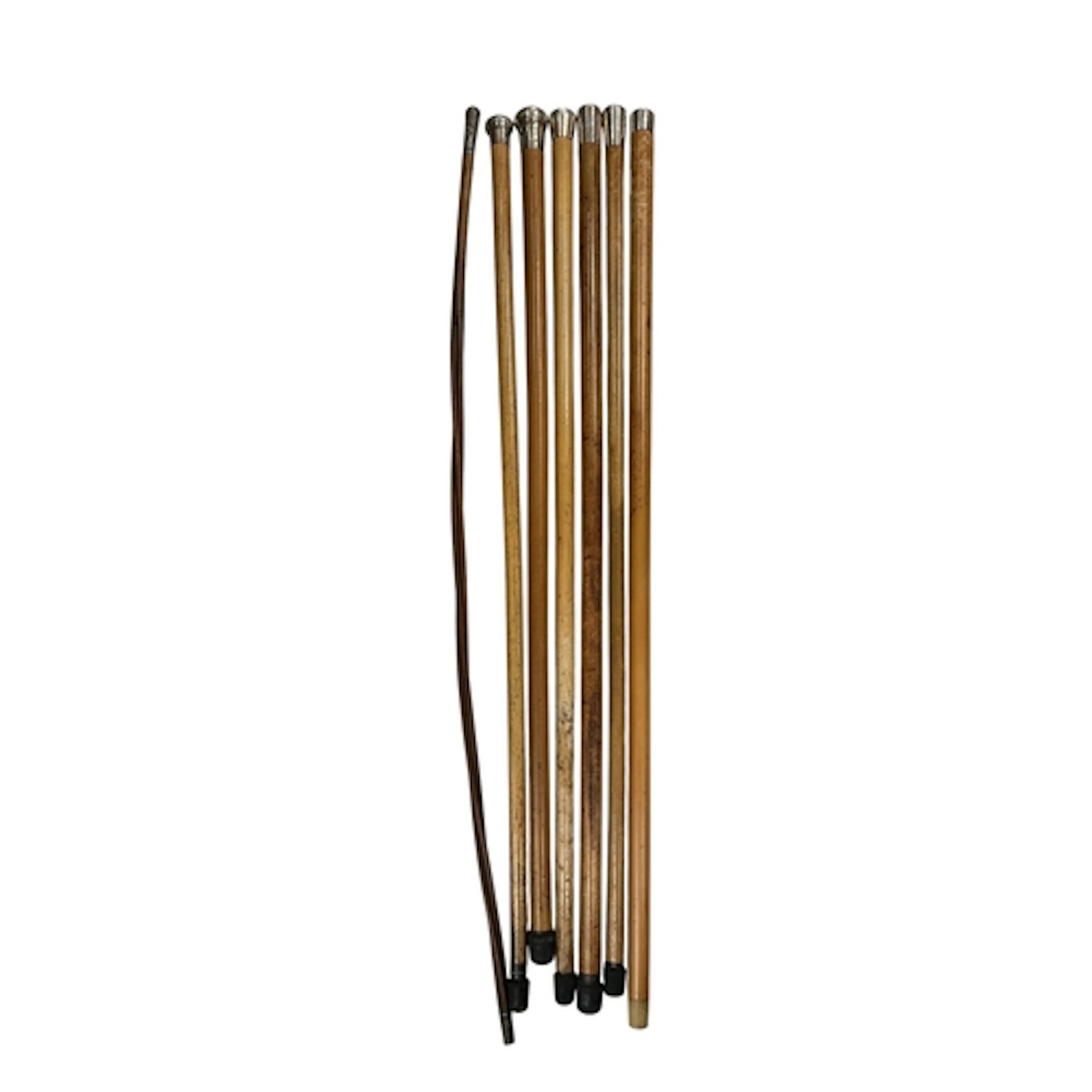 Six Victorian and later silver mounted malacca walking canes...