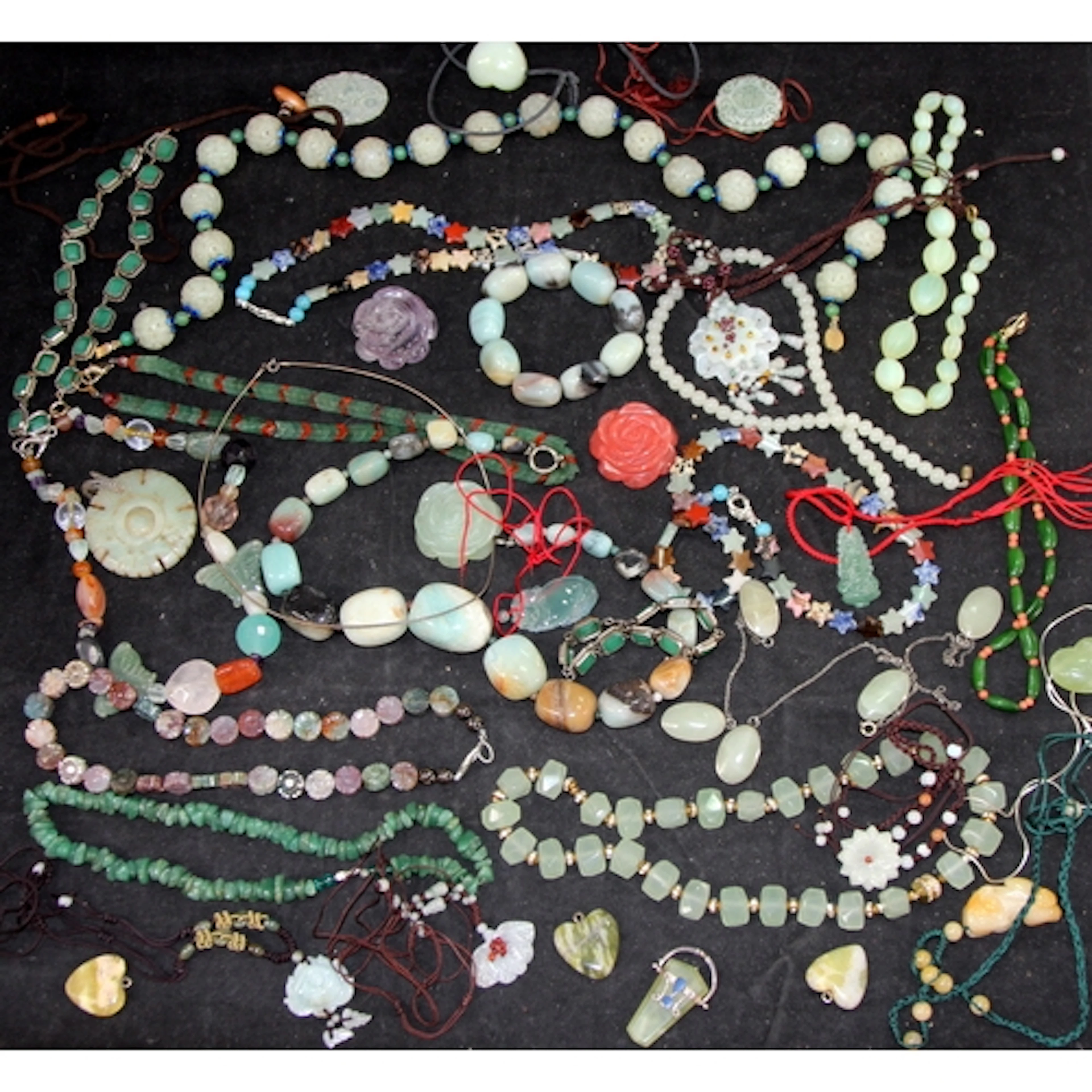 A collection of Jade and faux jade jewellery.