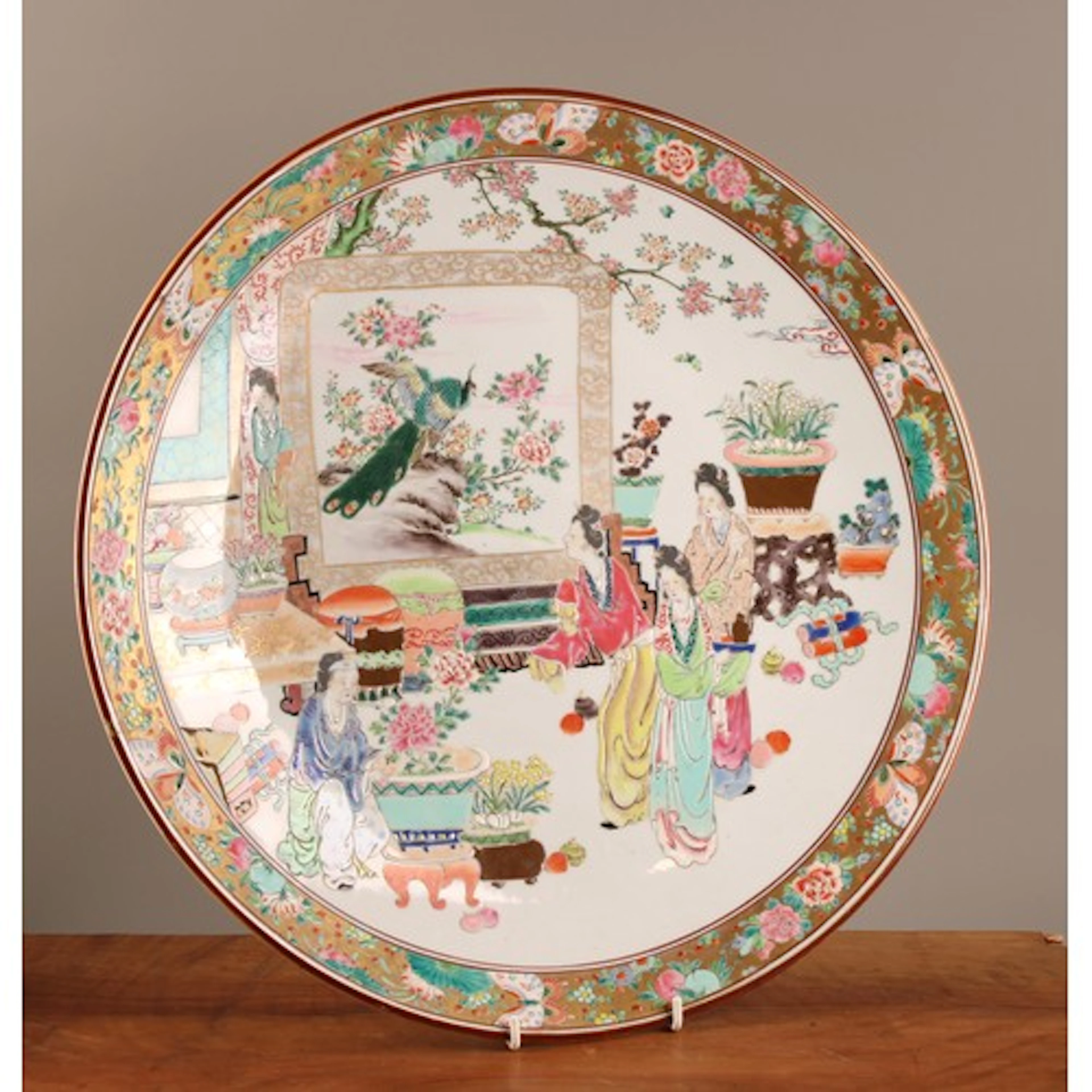 A Japanese circular charger, painted in polychrome enamels w...