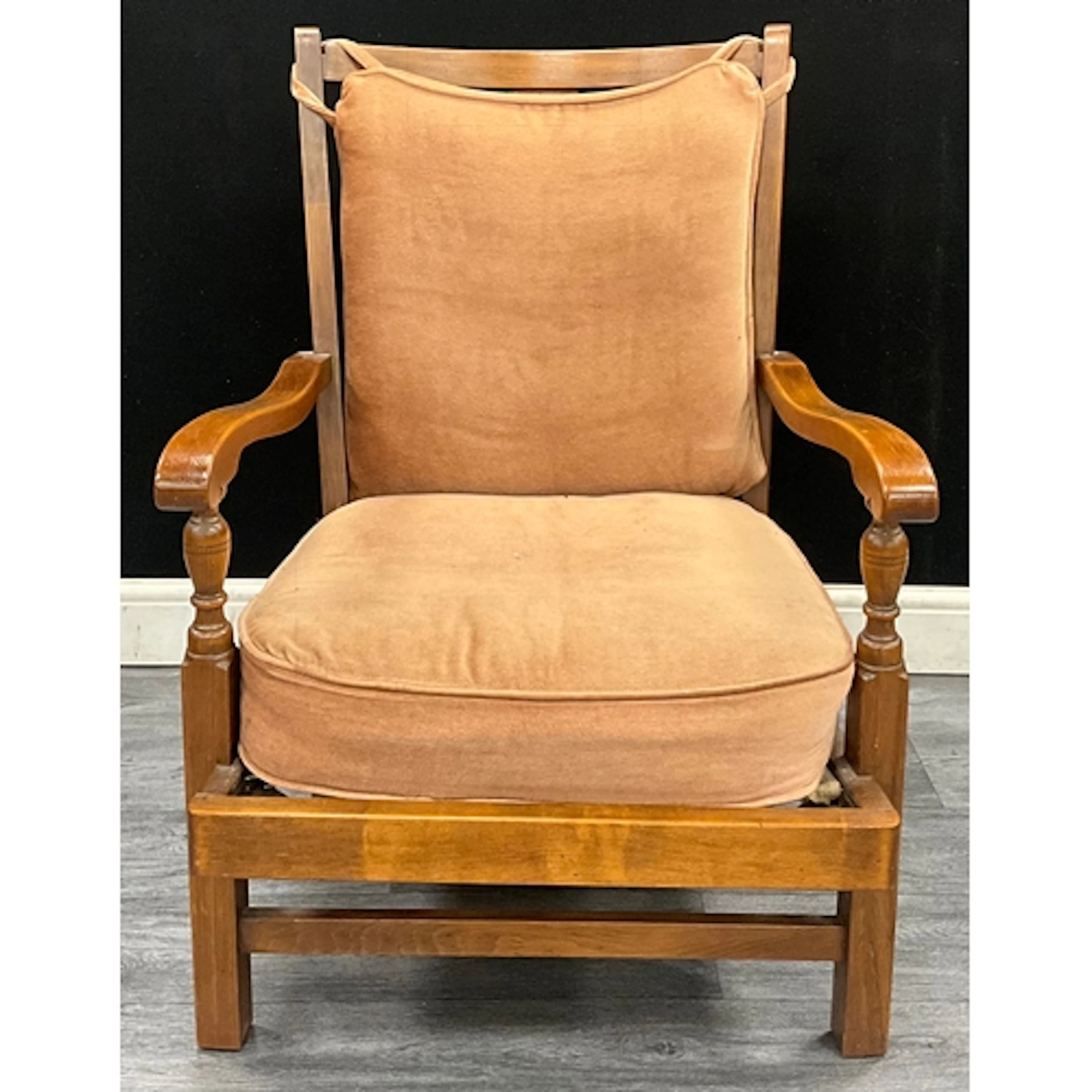 An art deco oak low armchair, curved back with decorative th...
