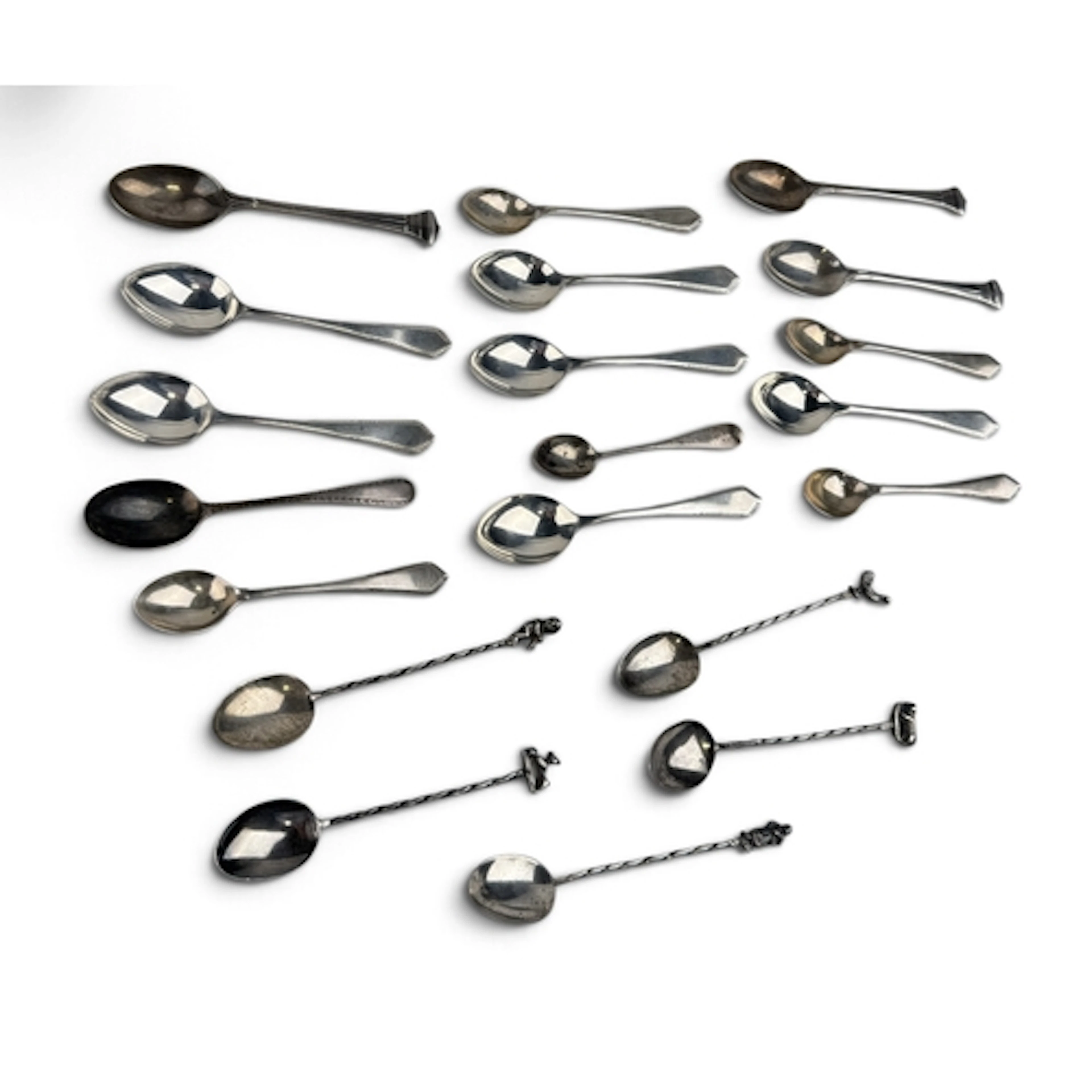 A COLLECTION OF SILVER TEASPOONS To include some examples by...