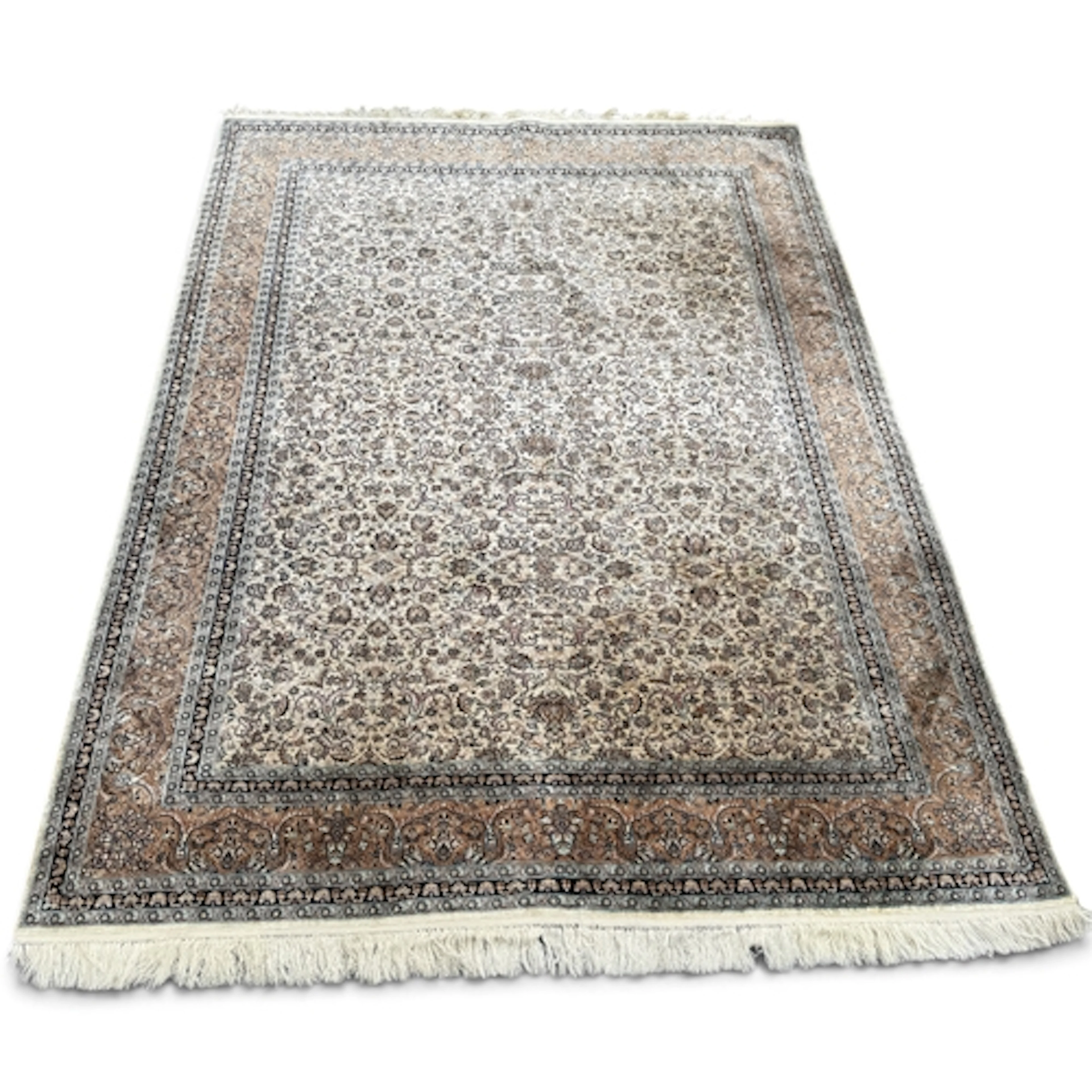 A PERSIAN CARPET 218cm x 154cm