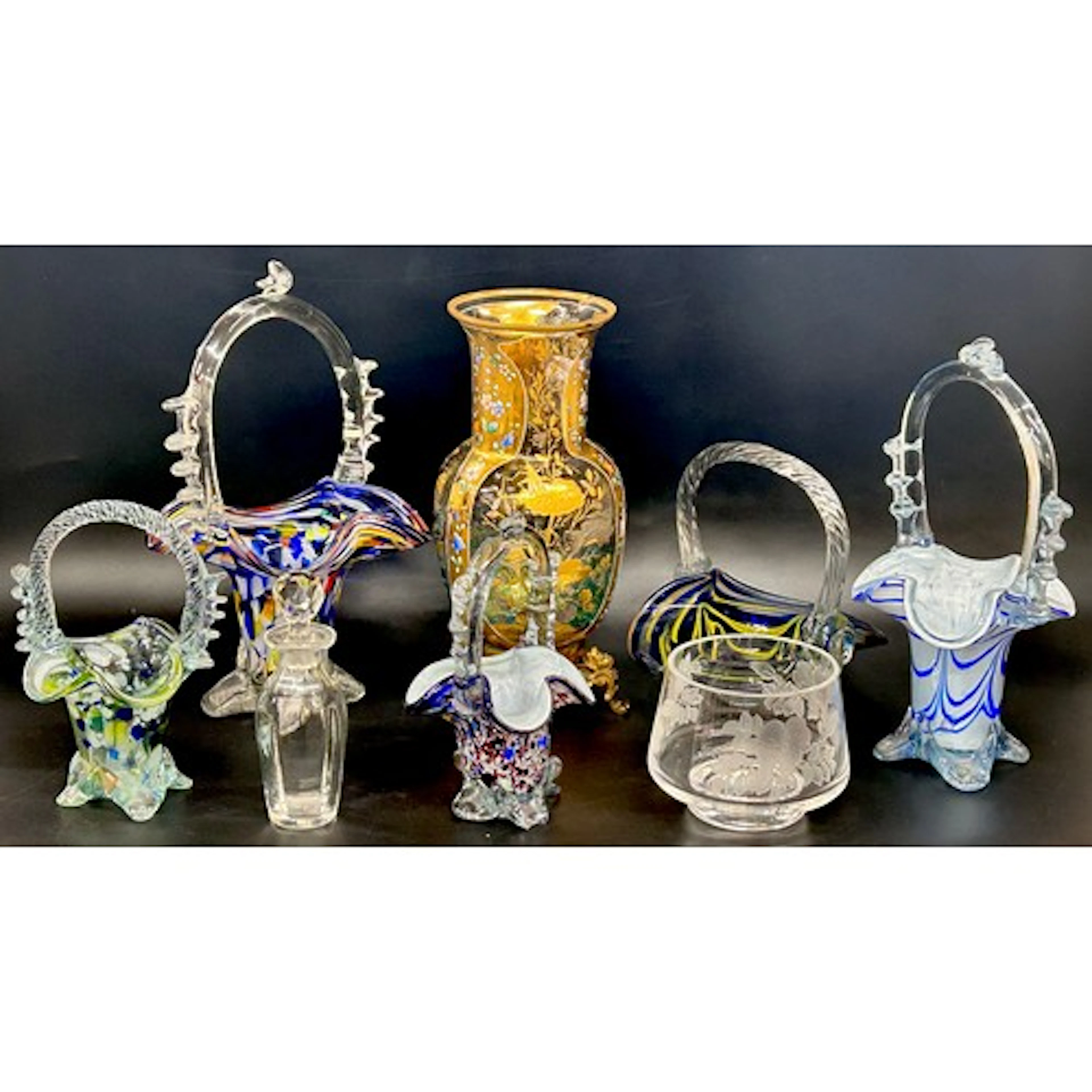 A collection of glassware; blow glass baskets, Stuart Crysta...