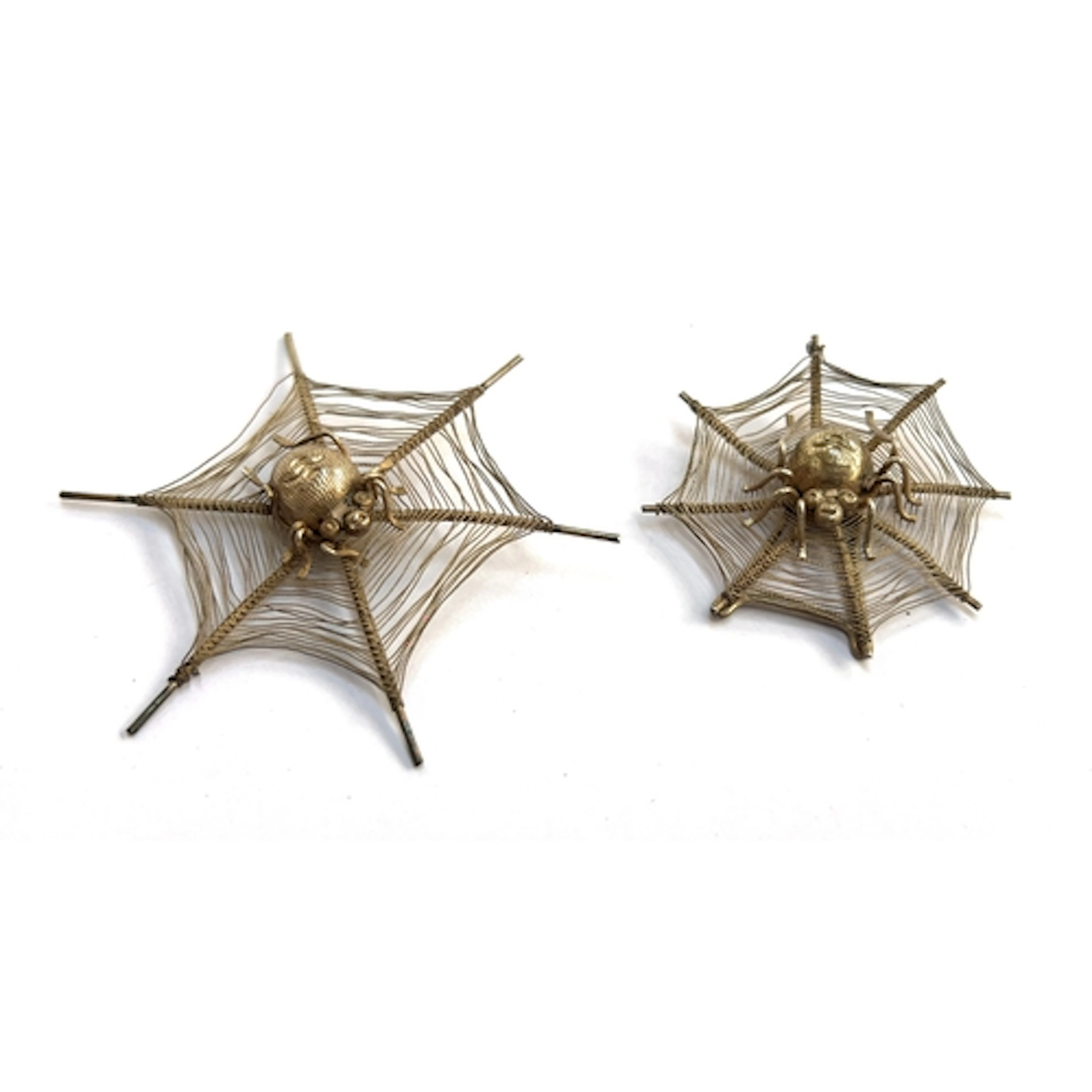 Two early 20th century Chinese white metal spider and web mo...