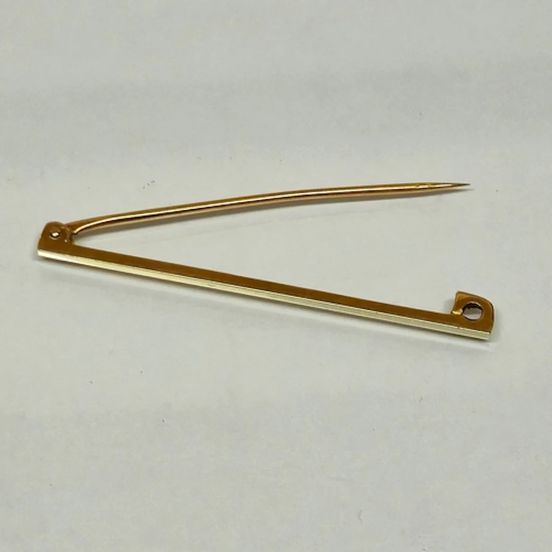 18ct white gold and 9ct yellow gold safety pin brooch, marke...
